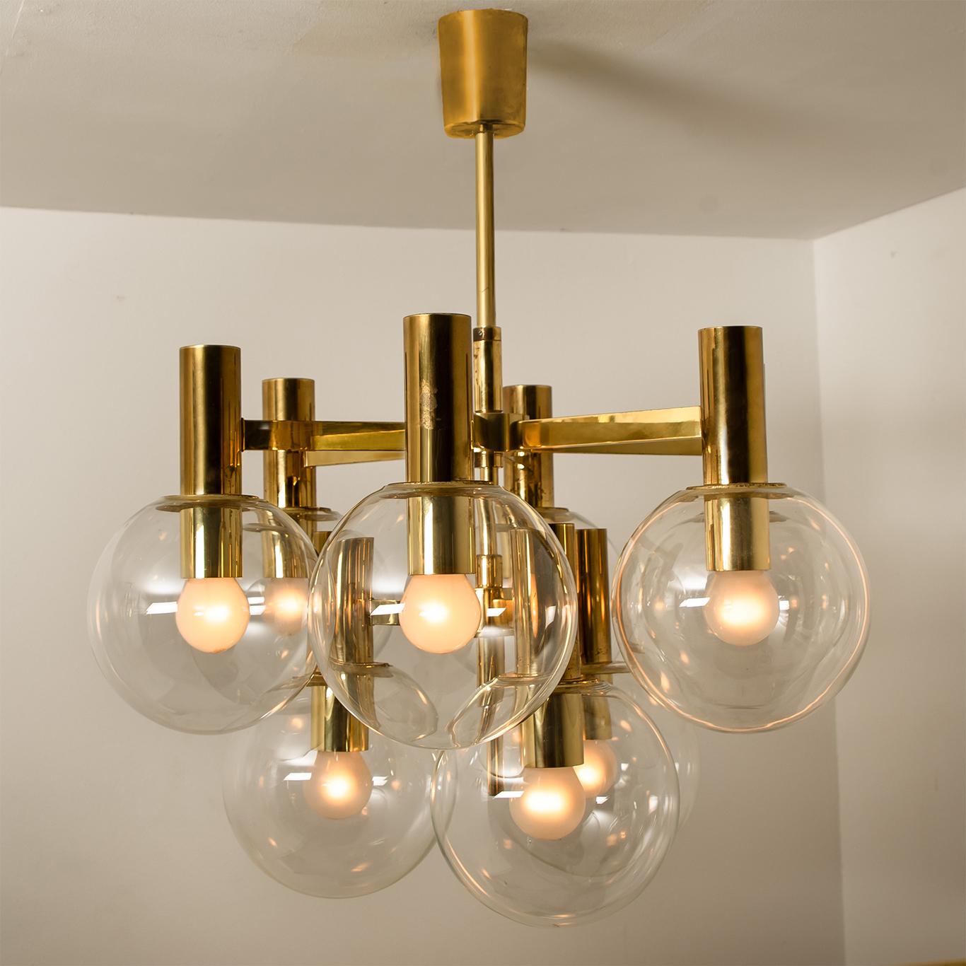A rare multi-globe Mid-Century Modern set of a chandelier and two wall lights with clear glass globes. The chandeliers are 9-armed and the wall lights are 2 armed. Designed in the style of Hans Agne Jakobsson. Illuminates beautifully.

Dimensions