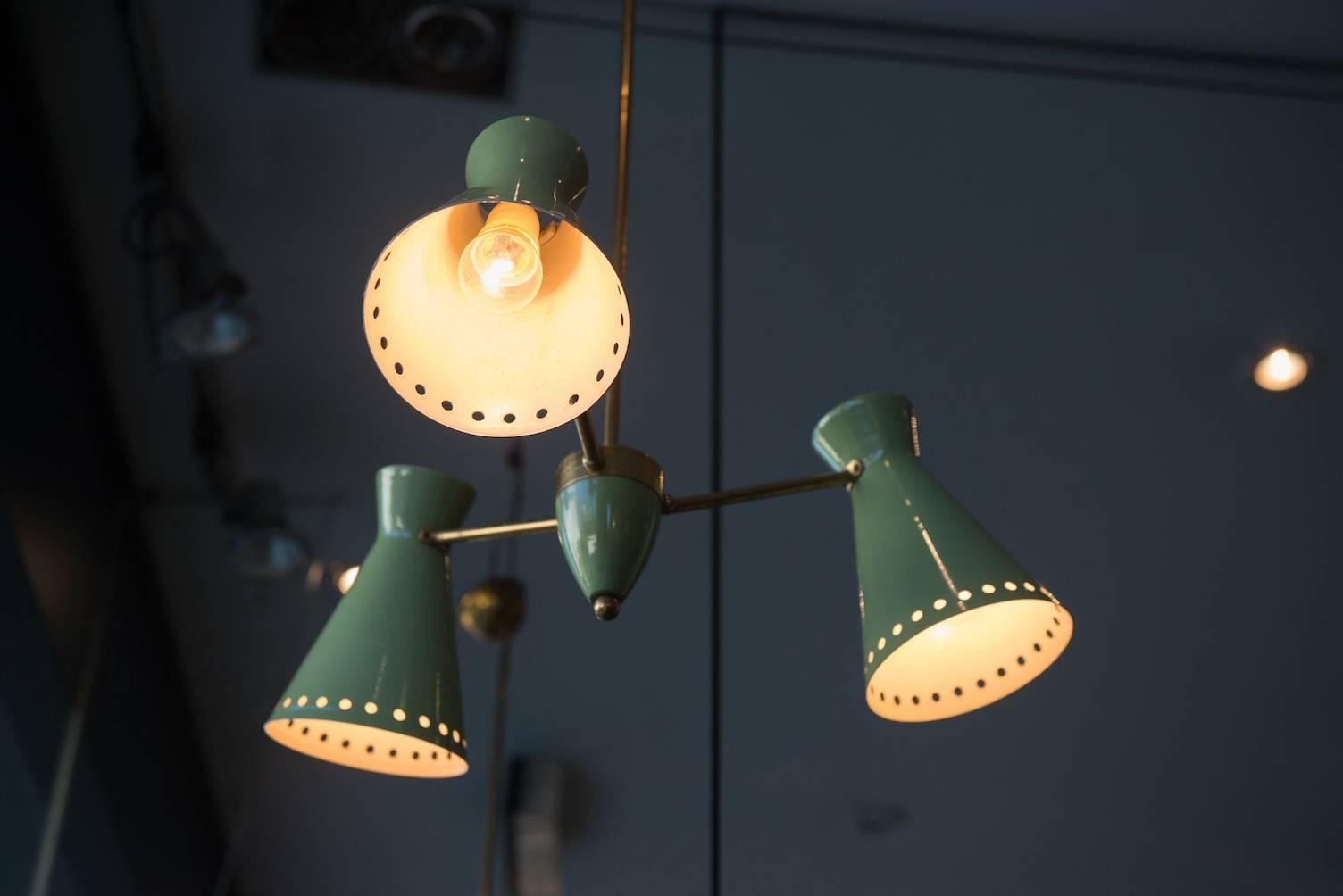 Three-light diabolo pendant, brass and light green lacquered metal.