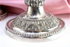 Three-light silver candelabrum with pearly friezes and beaded circular base