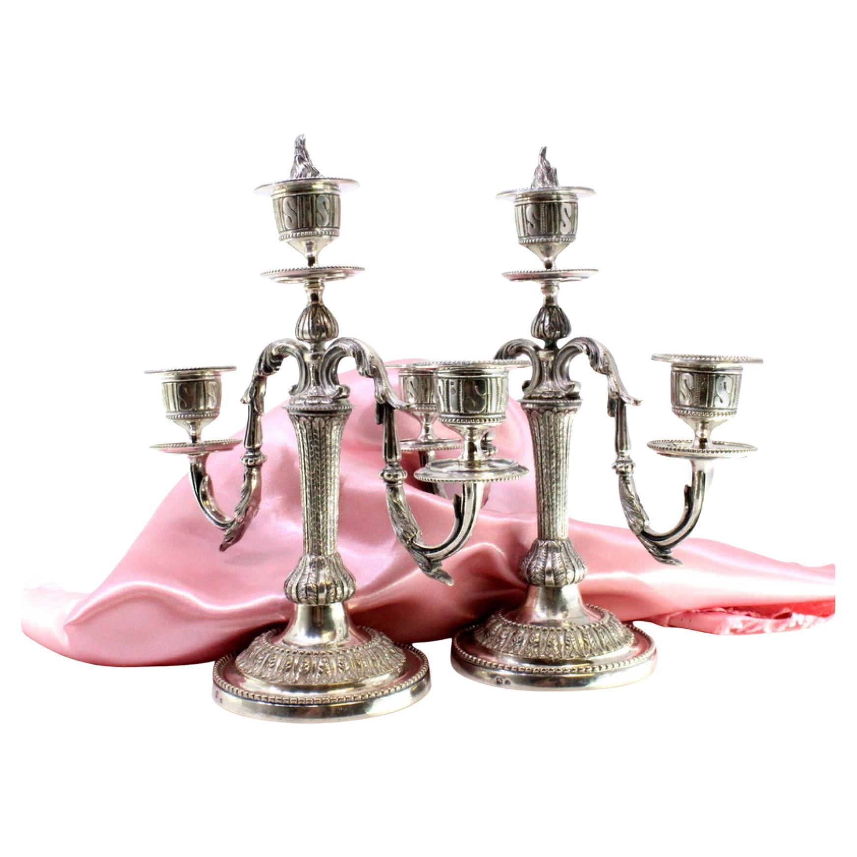 Three-light silver candelabrum with pearly friezes and beaded circular base