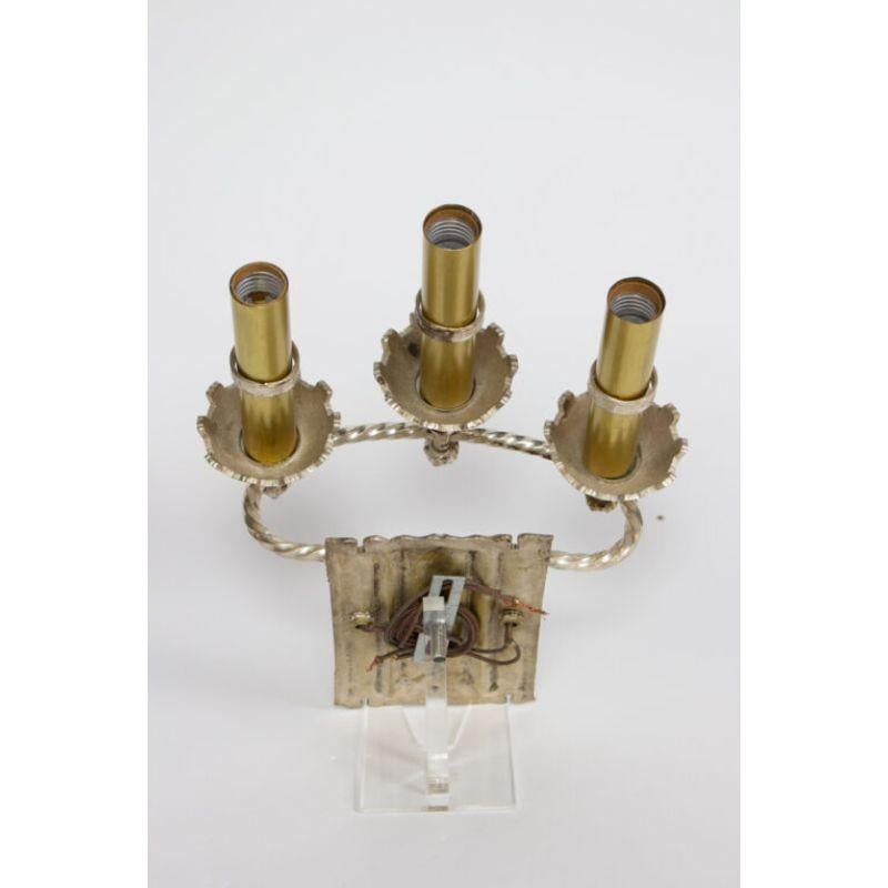 Three light silver sconce with brass accents, one of kind.

Material: Brass, Silver
Style: Gothic, Traditional
Place of Origin: United States
Period made: Early 20th Century
Dimensions: 12 × 7 × 13 in
Condition Details: Excellent Condition,