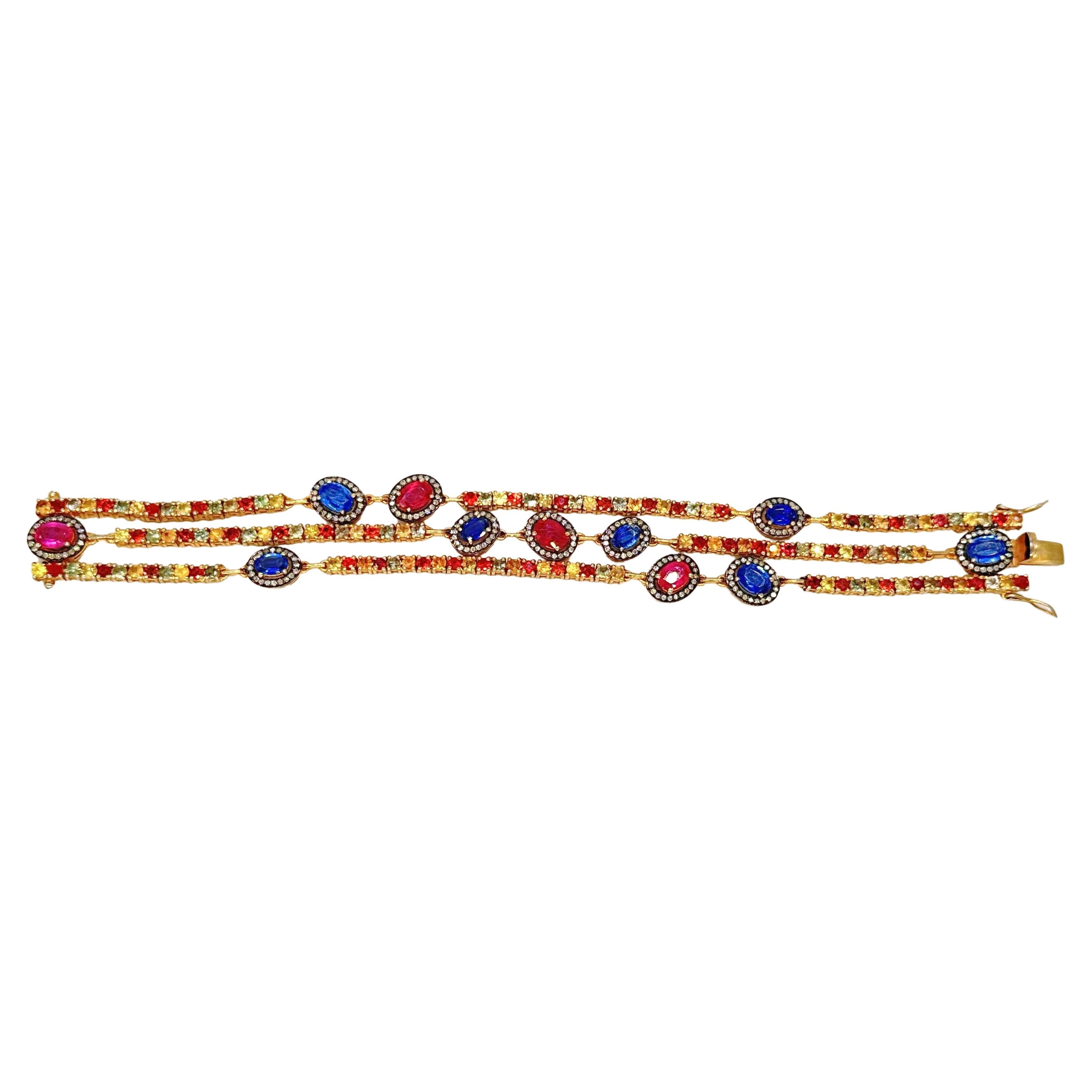 Mixed Cut Three-Line Gold Silver Bracelet with diamonds, Sapphires, Rubies, and Emeralds For Sale