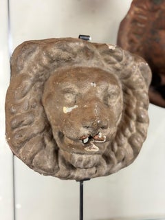 Three lions concealing the drainpipe, cast iron and terracotta façade decoration