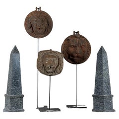 Three lions concealing the drainpipe, cast iron and terracotta façade decoration