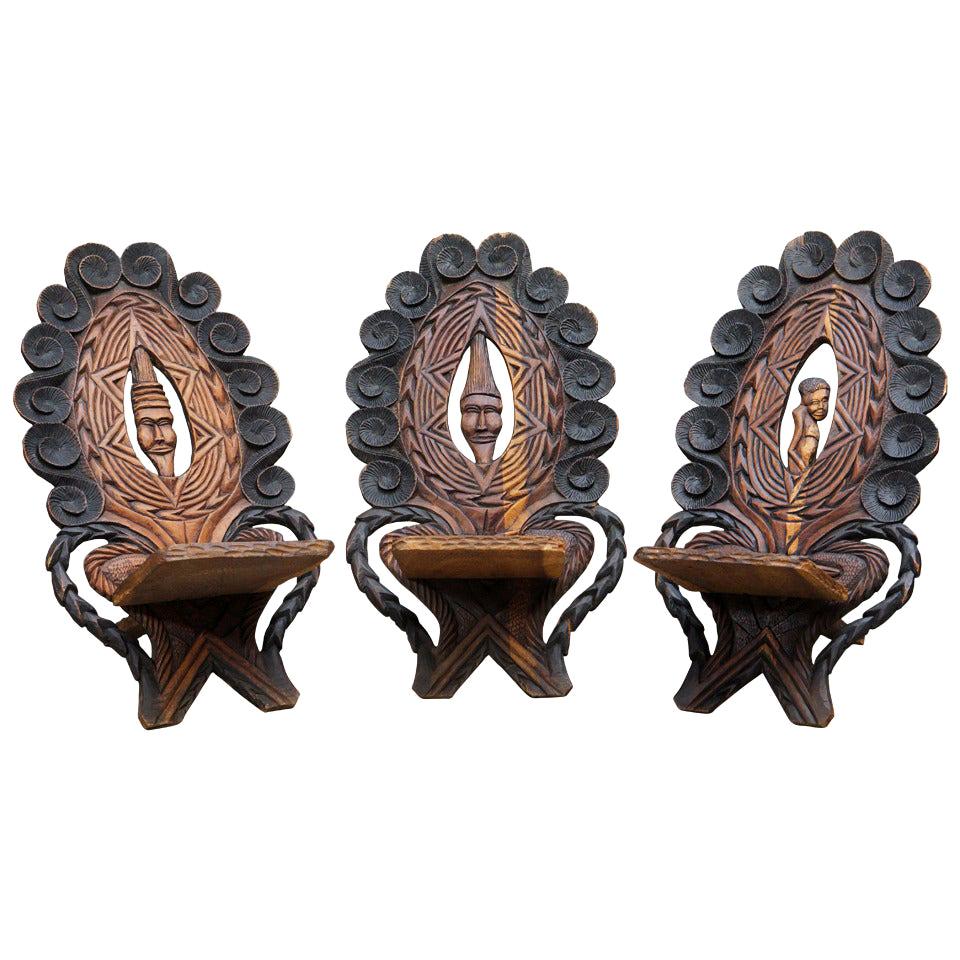 Three-Low Slung Hand Carved African Lounge Chairs from Congo For Sale