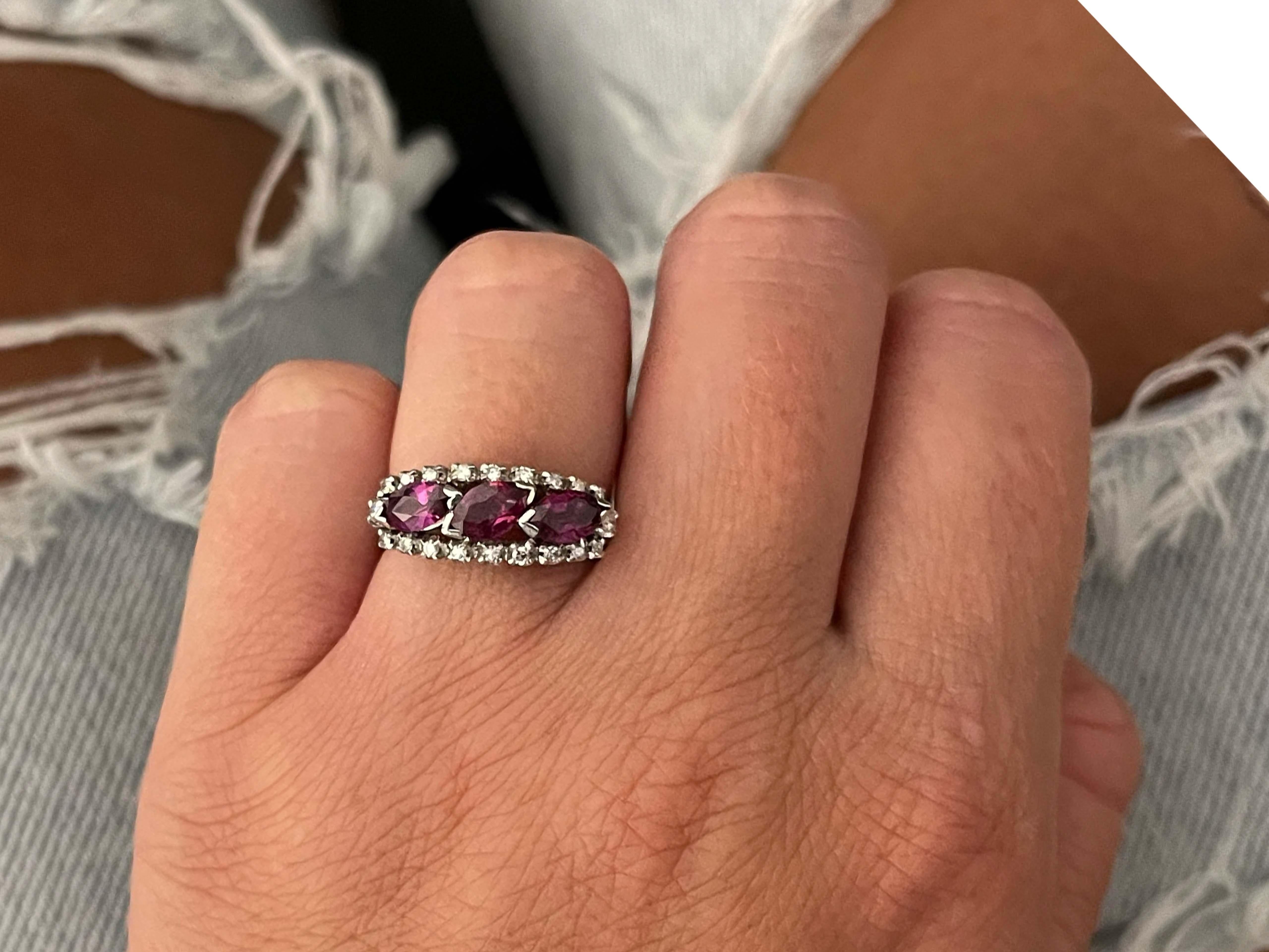 Item Specifications:

Metal: 18k White Gold

Style: Statement Ring

Ring Size: 5.5 (resizing available for a fee)

Total Weight: 4.4 Grams

Gemstone Specifications:

Gemstones: 3 marquis red rubies

Ruby Total Carat Weight: ~1.50 carats
​
​Diamond