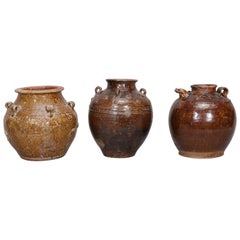 Three Martaban Stoneware Pots in Various Sizes and Designs