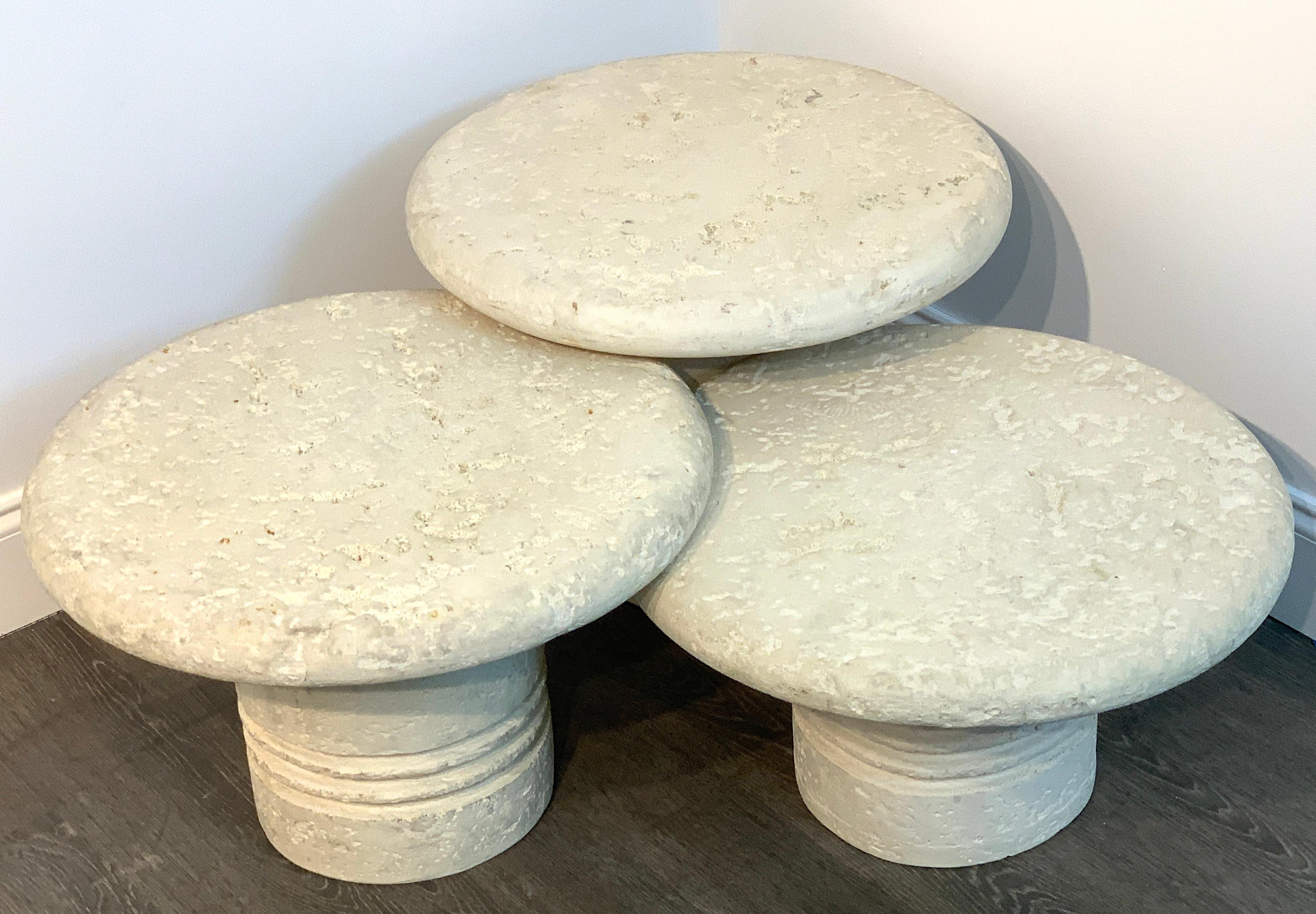 Three midcentury coral stone mushroom coffee tables or stools, each one naturalistically modeled, in graduating height of 16
