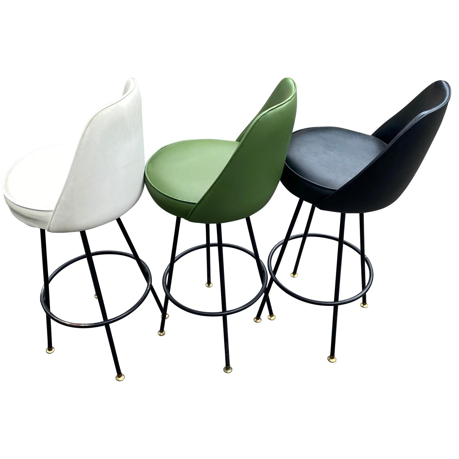3 Mid-Century Modern swivel bar stools in period tri color vinyl upholstery.
 