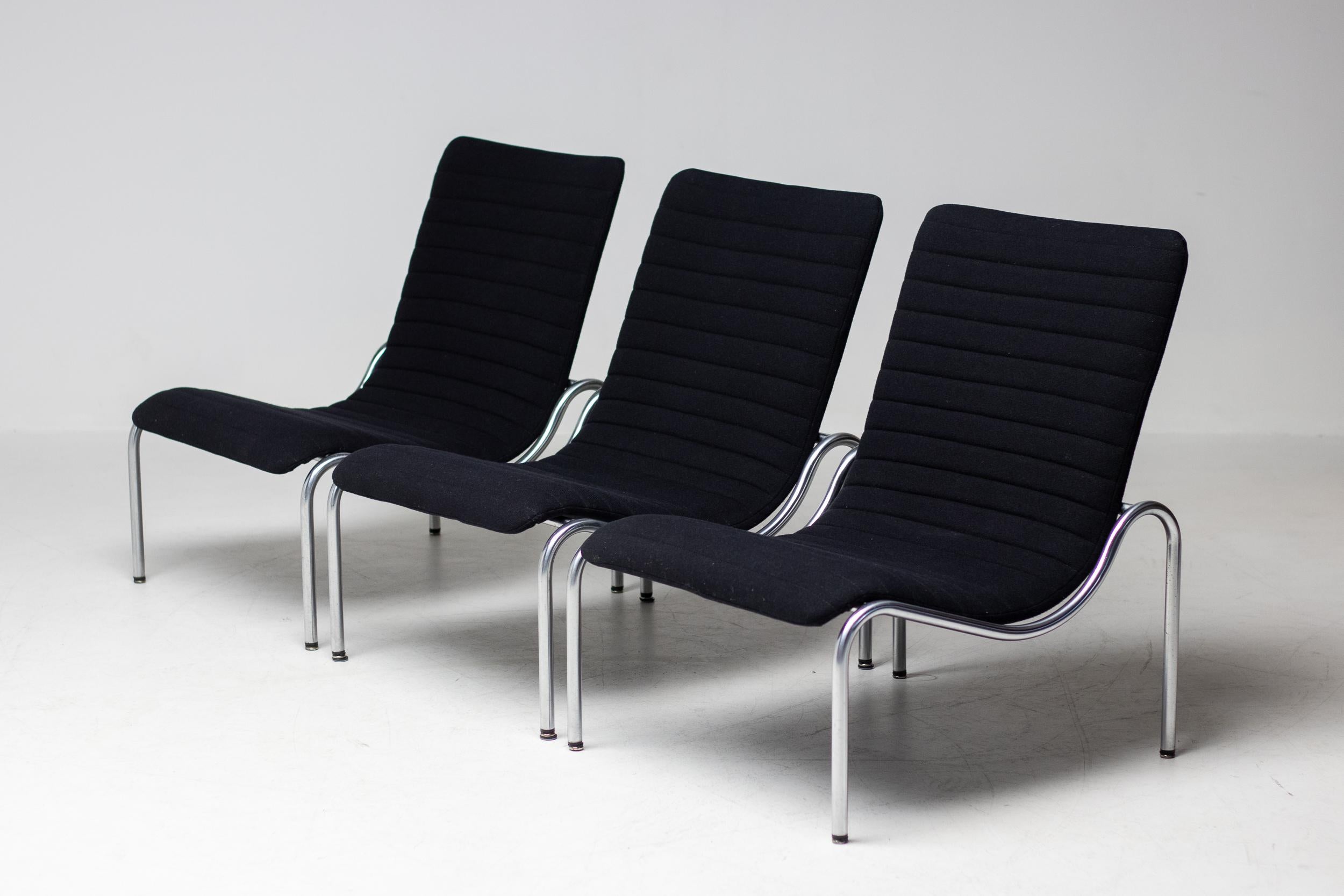 Set of 3 lounge chairs No. 704 designed by Kho Liang Ie for Stabin Woerden, the Netherlands.
Elegant and very comfortable Minimalist design by the Dutch modernist master. 
Beautiful matte chrome frame with black Hopsak upholstery.
This wonderful
