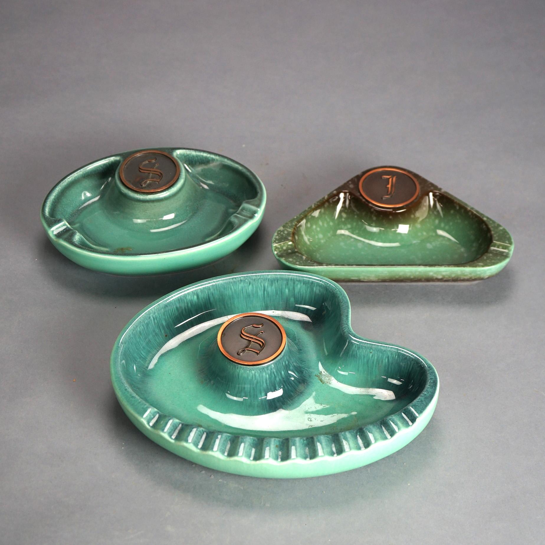 Three Mid Century Modern Roseville Hyde Park Art Pottery Ashtrays; shapes include circle, triangle & stylized nautilus; Mid 20thC

Measures - largest 10.75