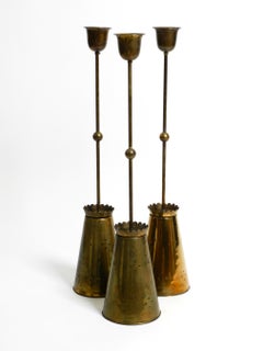 Three Mid Century pendants with a diabolo design in perforated sheet brass