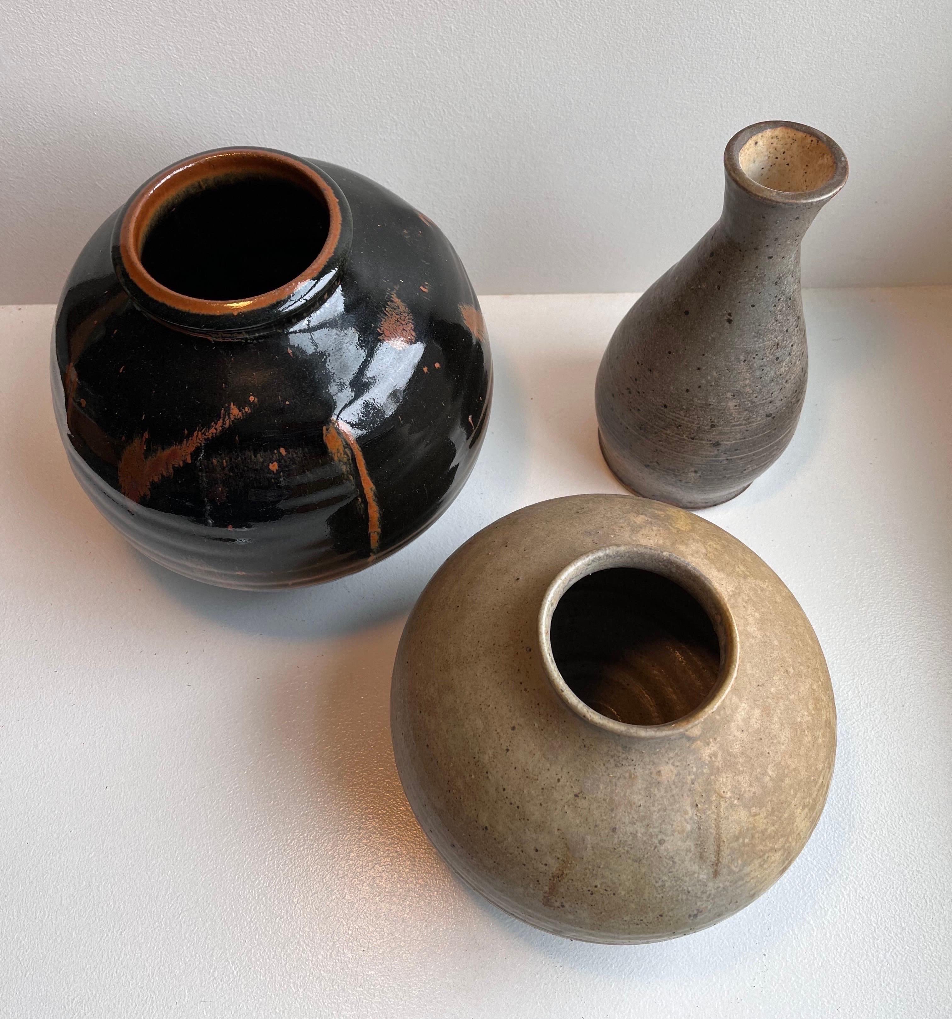 Three midcentury vintage pots. 

Dark grey - 10 tall x 5