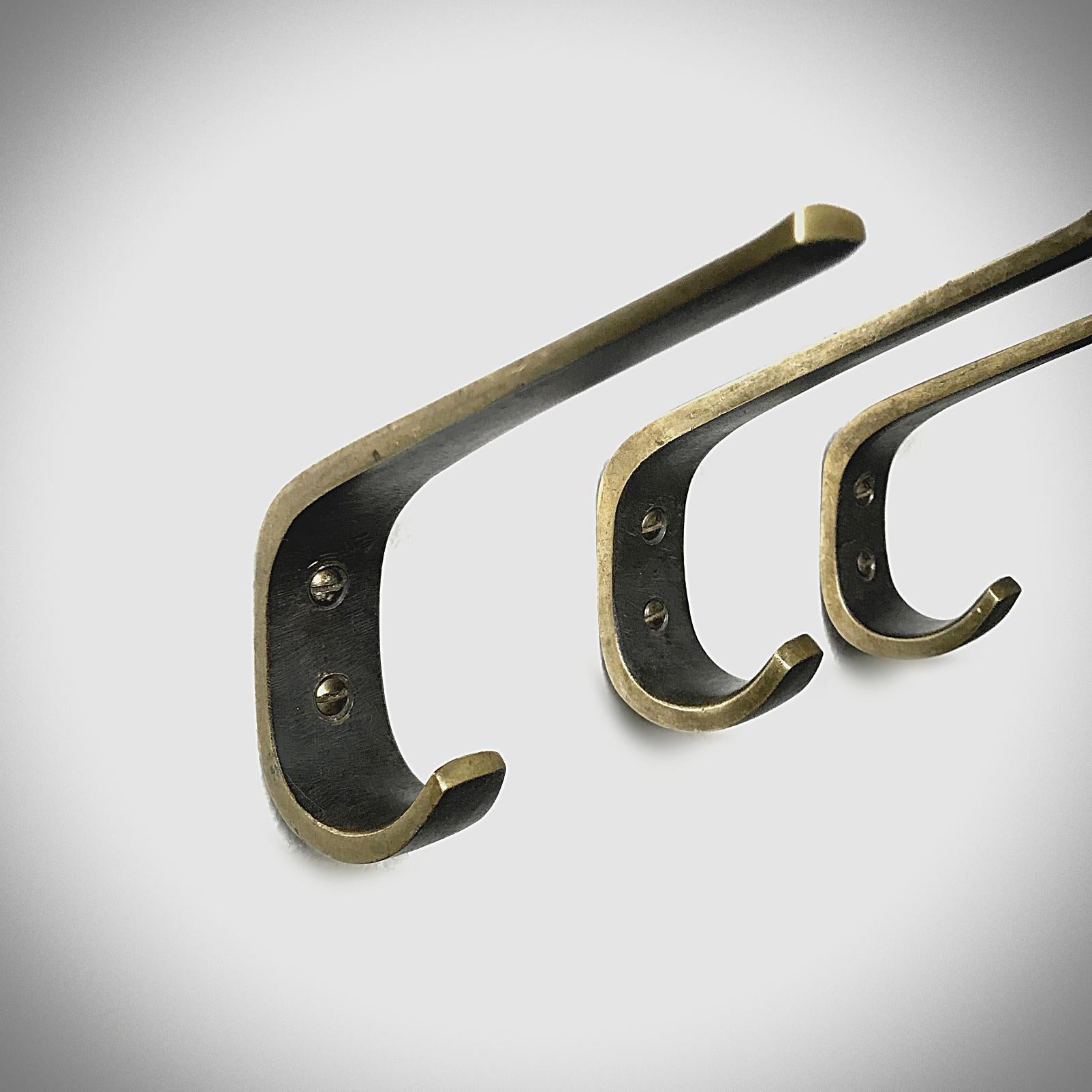 Beautiful Austrian Mid-Century Modern solid brass hooks from the 
