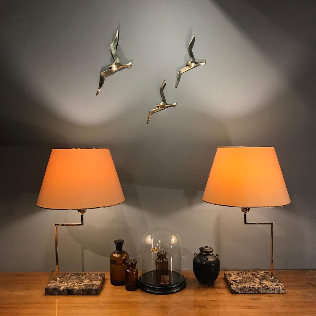 Three beautiful Austrian midcentury solid brass wall-mounted bird sculptures from 1950s. They are in the style of Auböck and competed with Auböck in their time. They are made of matt polished solid brass.

Width from 10 - 14 in.