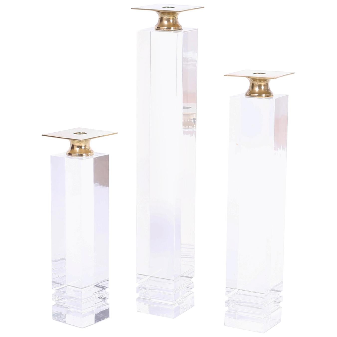 Three Midcentury Lucite and Brass Candlesticks For Sale