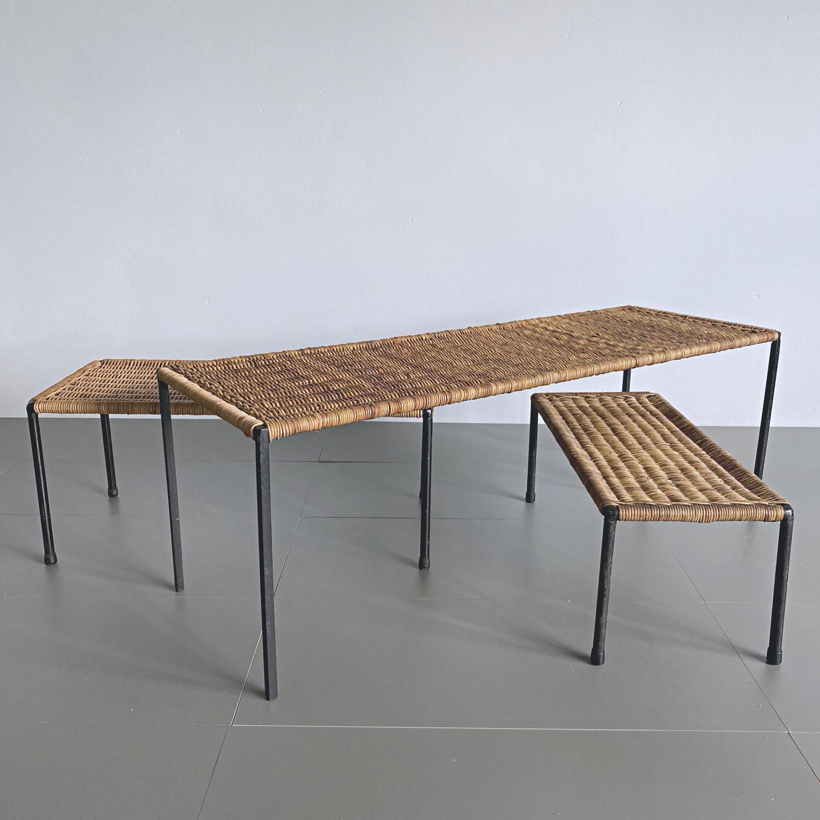 Beautiful and authentic rattan coffee and side tables, manufactured by Carl Auböck Werkstätte in the 1950s, Vienna. The frames are made of black lacquered steel with woven rattan top. The tables can be used indoor and outdoor.

We ship only with