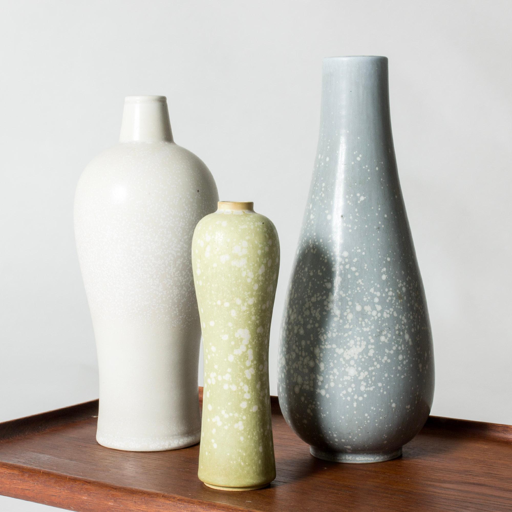 Set of three beautiful stoneware vases by Gunnar Nylund, in imaginative, curvesome forms. “Mimosa” patterned glazes in eggshell white, pale green and cloudy blue.

Height 18/25/27 cm, Diameter 5.5-10 cm.

Gunnar Nylund was one of the most