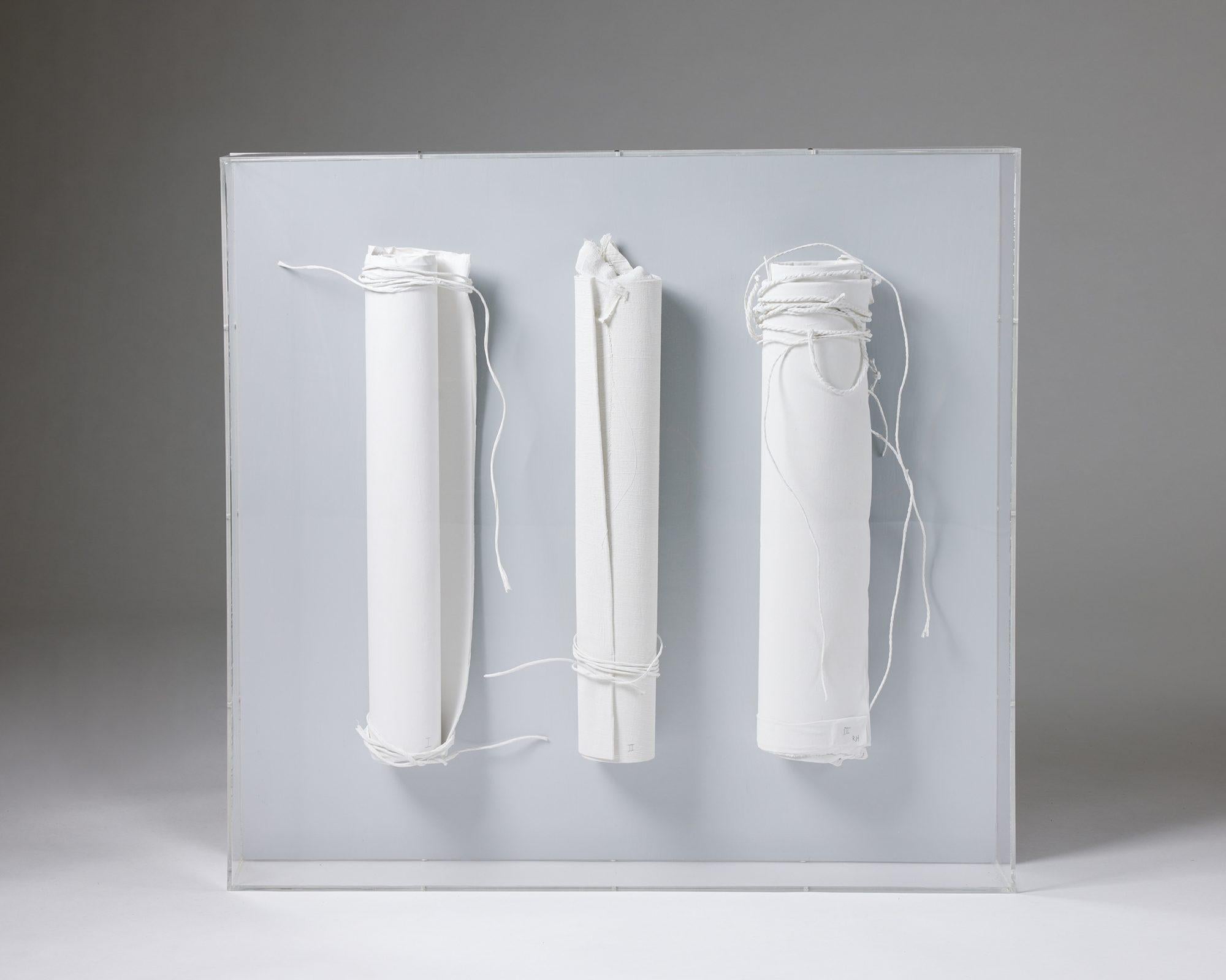 Three mounted scrolls by Rune Hagberg,
Sweden, 1970s.

Paper scrolls mounted on a board in a plexiglass box.

Unique.

Signed.

H: 76 cm
W: 81 cm
D: 12 cm

Rune Fredrik Hagberg was a renowned Swedish artist that took much of his