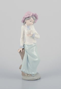 Three Nao porcelain figurines. Boys and girls with pets.