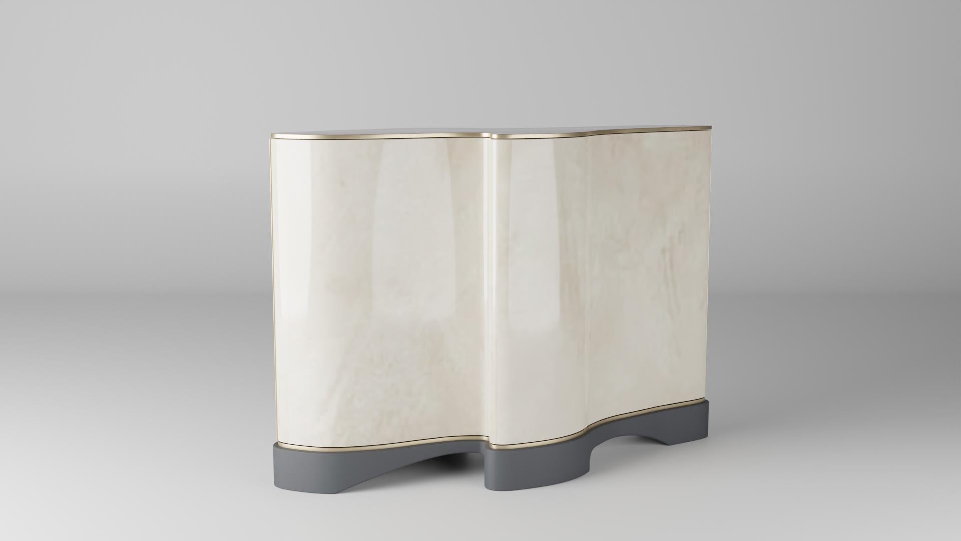 The Extruder Holocene sideboard has been designed and created by extruding a cut from the Holocene dining table sculptural form. The organic shape has a waterfall-like feeling cascading around the shape of the piece. Two doors hinge on custom-made