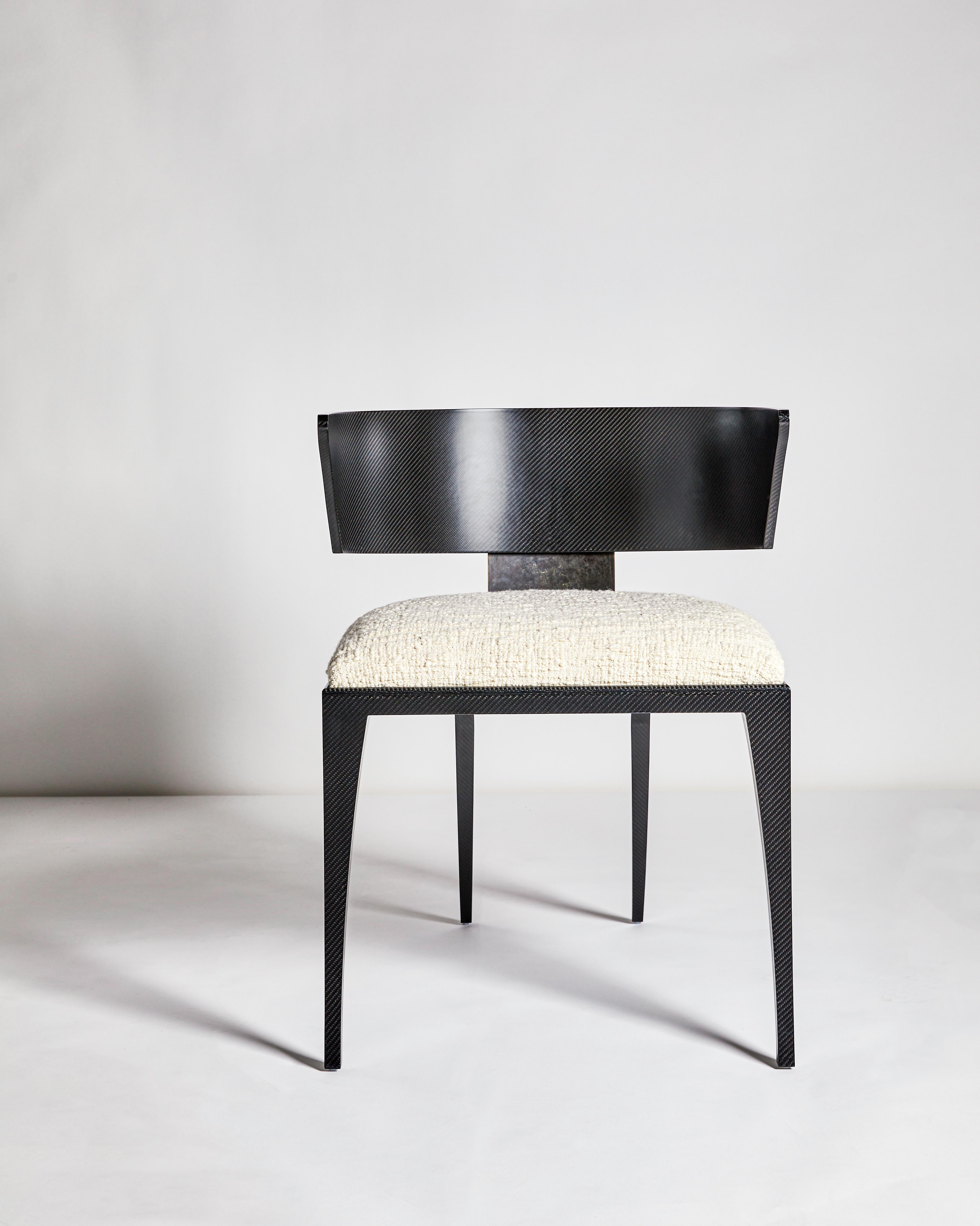 The Hope chair is inspired by the original Klismos chair first produced in ancient Greece. Popularised in Regency Britain by Thomas Hope, the design has been contemporised and redefined using carbon fibre for delicate structure and a cast bronze