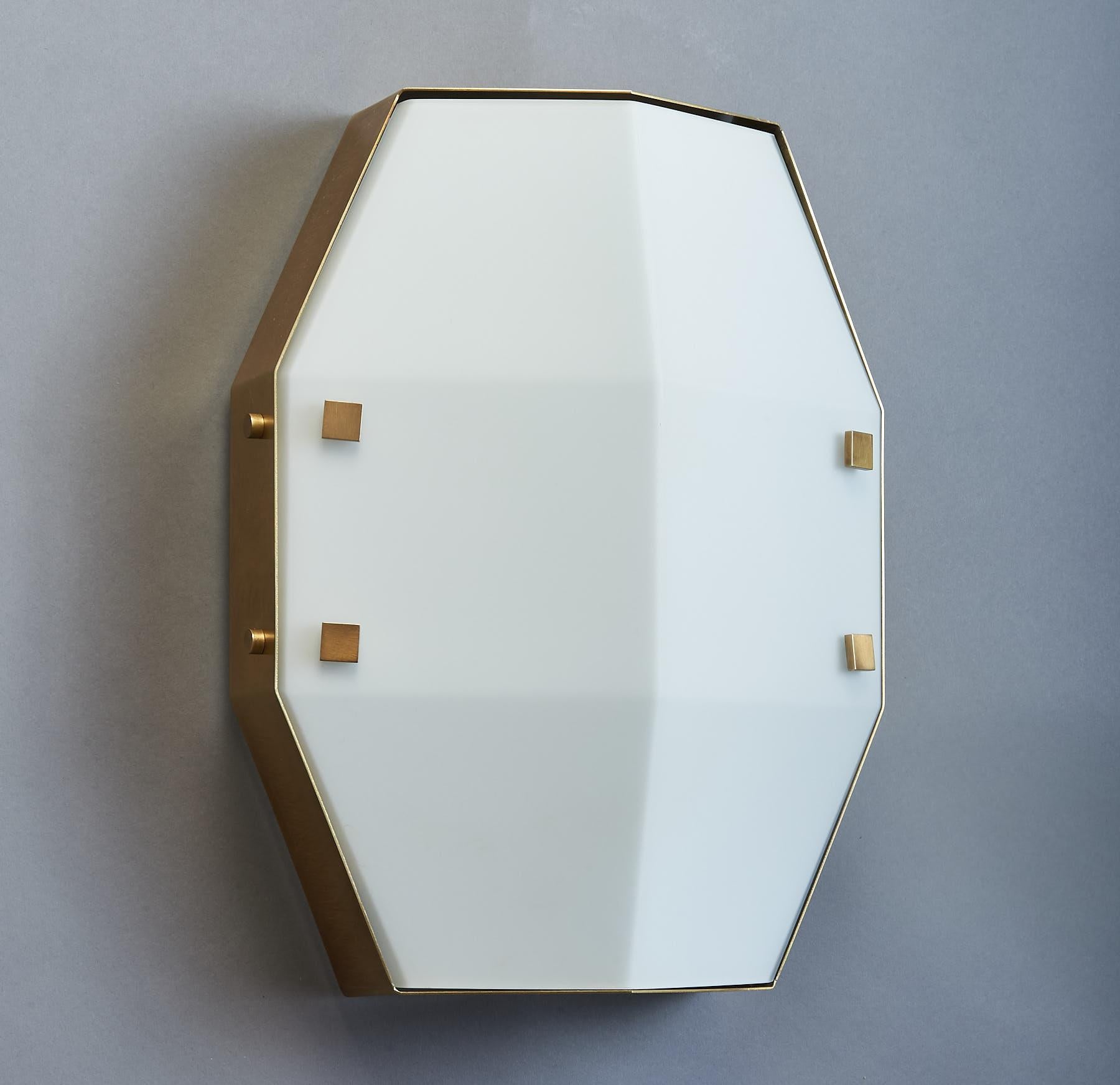 ARREDOLUCE
Pair of wall sconces, satin finish brass with angled and shaped satin opaline glass shades.
Can also be mounted as flush mount ceiling lights. Italy 1960s
Sold and priced by the pair.
Dimensions: 14 W x 11 D x 5 H
Rewired for use in the