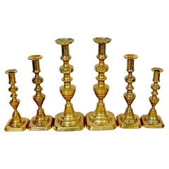 Three Pair of 19th C. English Brass Graduating Beehive Push-Up Candlesticks