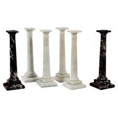 Tres pares de candeleros grandes de mármol tallado