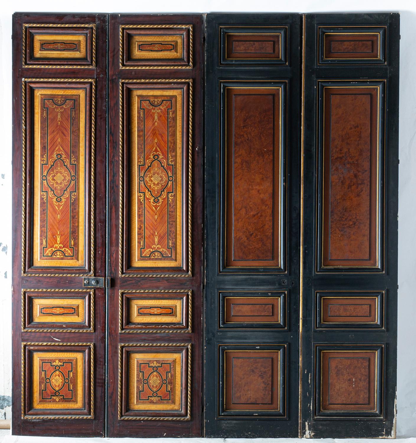 Three pairs of double doors in solid oak, painted in imitation of marquetry (walnut burl, rosewood, sycamore burl). The reserves are surrounded by a gilded wood molding, 
Two of the pairs are double-sided, the third pair has one side painted in