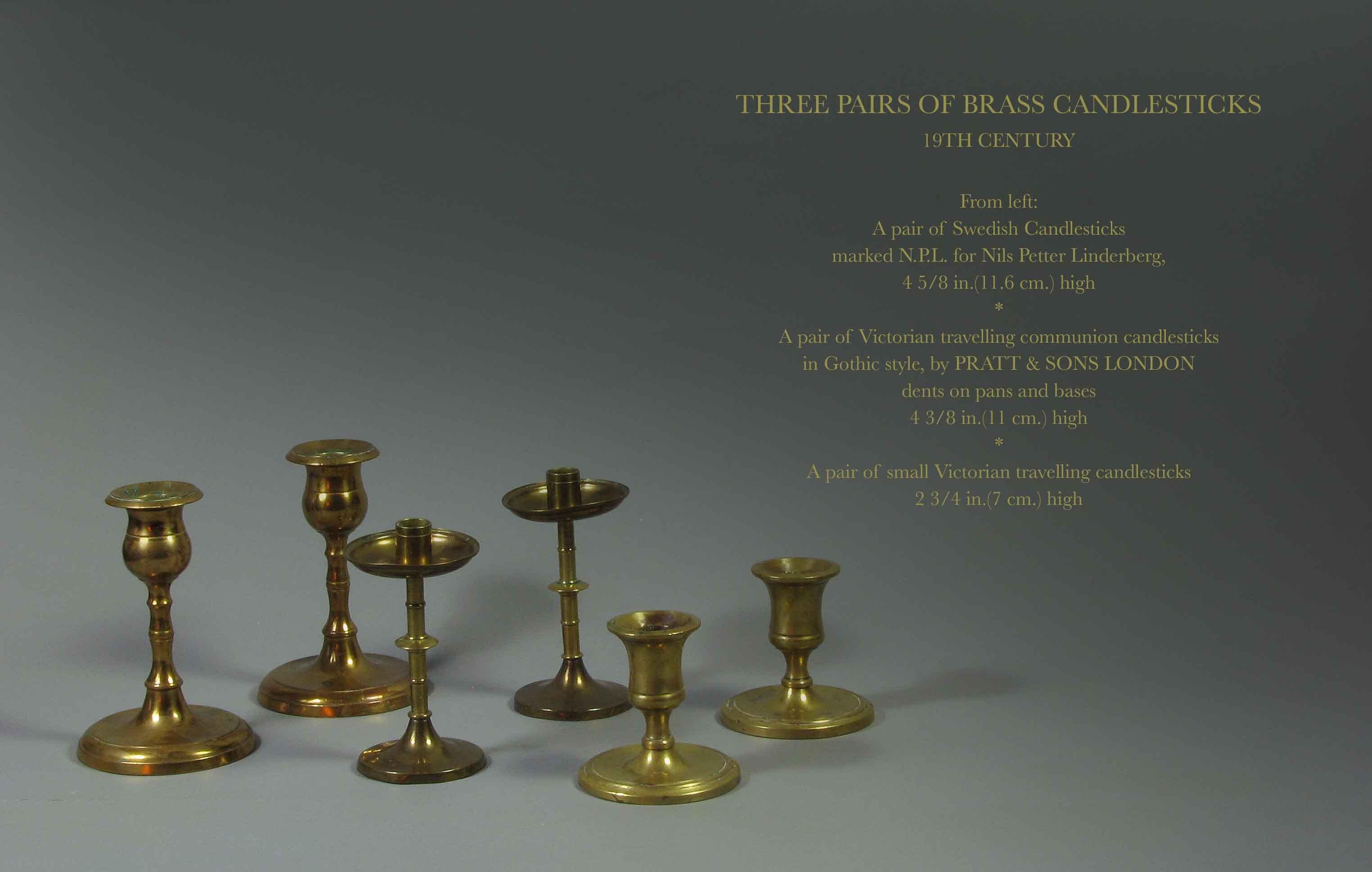 Three pairs of brass candlesticks
19th century
From left:
A pair of Swedish candlesticks
marked N.P.L. for Nils Petter Linderberg,
4 5/8 in.(11.6 cm.) high
*
A pair of Victorian travelling communion candlesticks
in Gothic style, by PRATT &