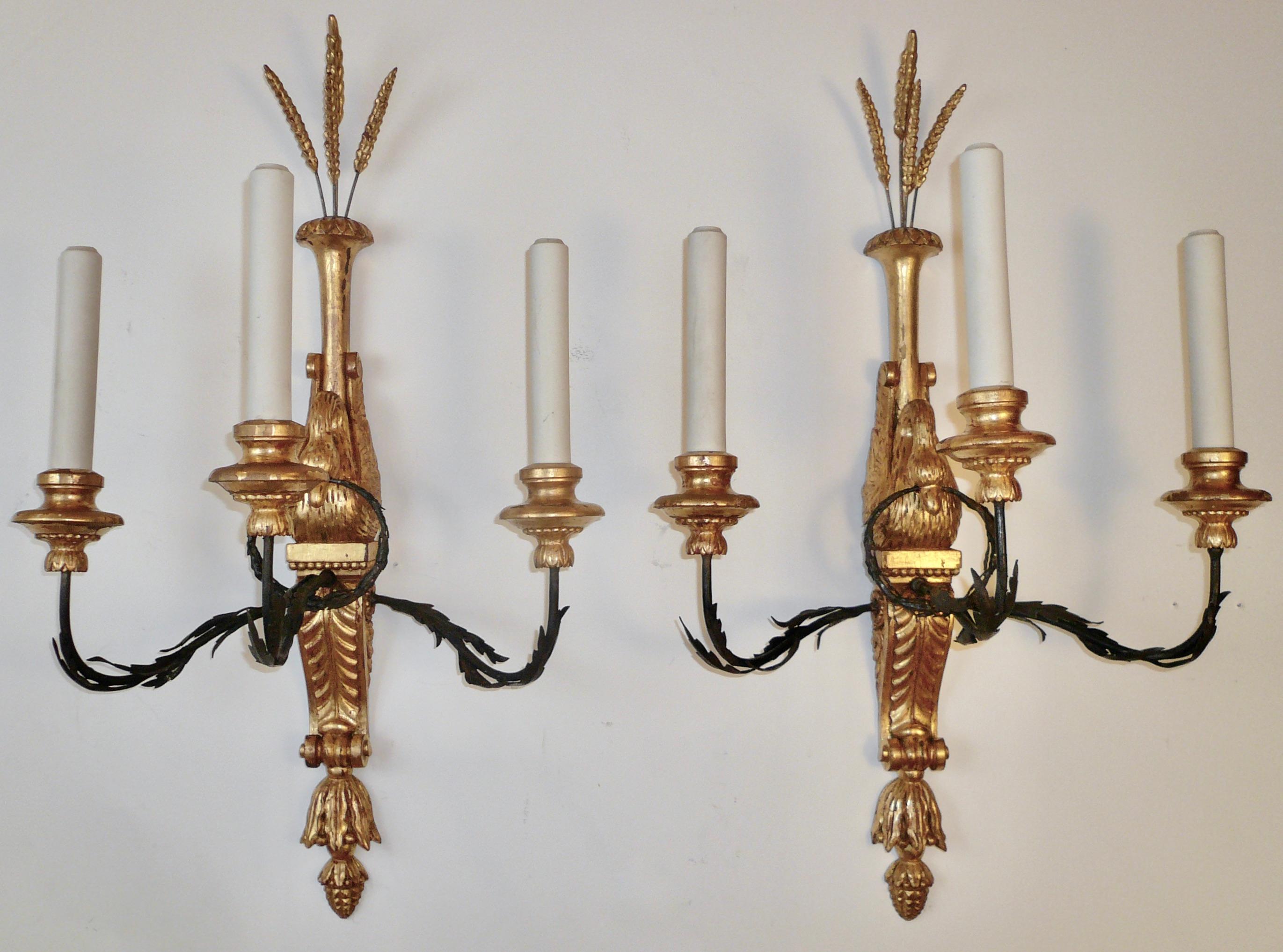 Neoclassical Three Pairs of Signed E. F. Caldwell Carved Giltwood and Iron Swan Form Sconces For Sale
