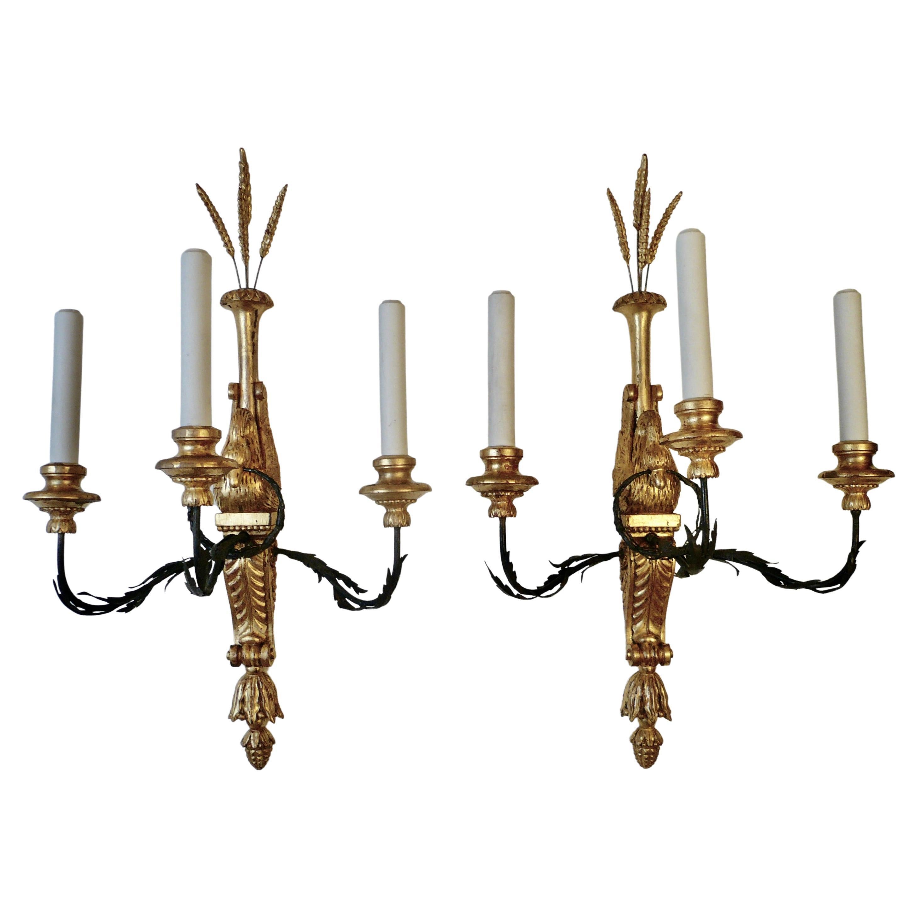 Three Pairs of Signed E. F. Caldwell Carved Giltwood and Iron Swan Form Sconces