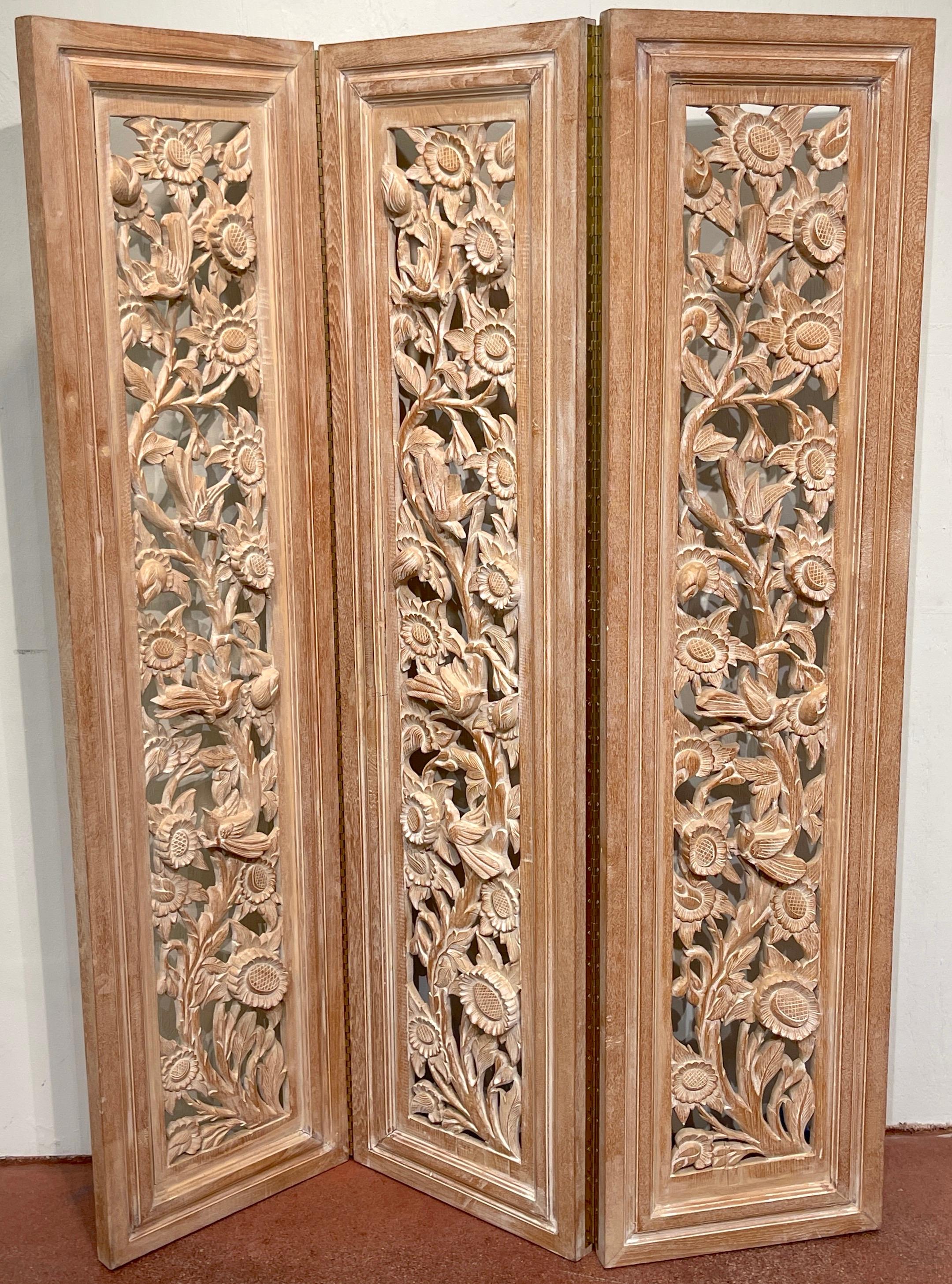 Three-Panel Carved Bleached Hardwood Bird Floral Screen, Style of James Mont 
Circa 1950s

An Exquisite Three-Panel Carved Bleached Hardwood Bird Floral Screen, Step into the elegance of the 1950s with this captivating carved hardwood screen,