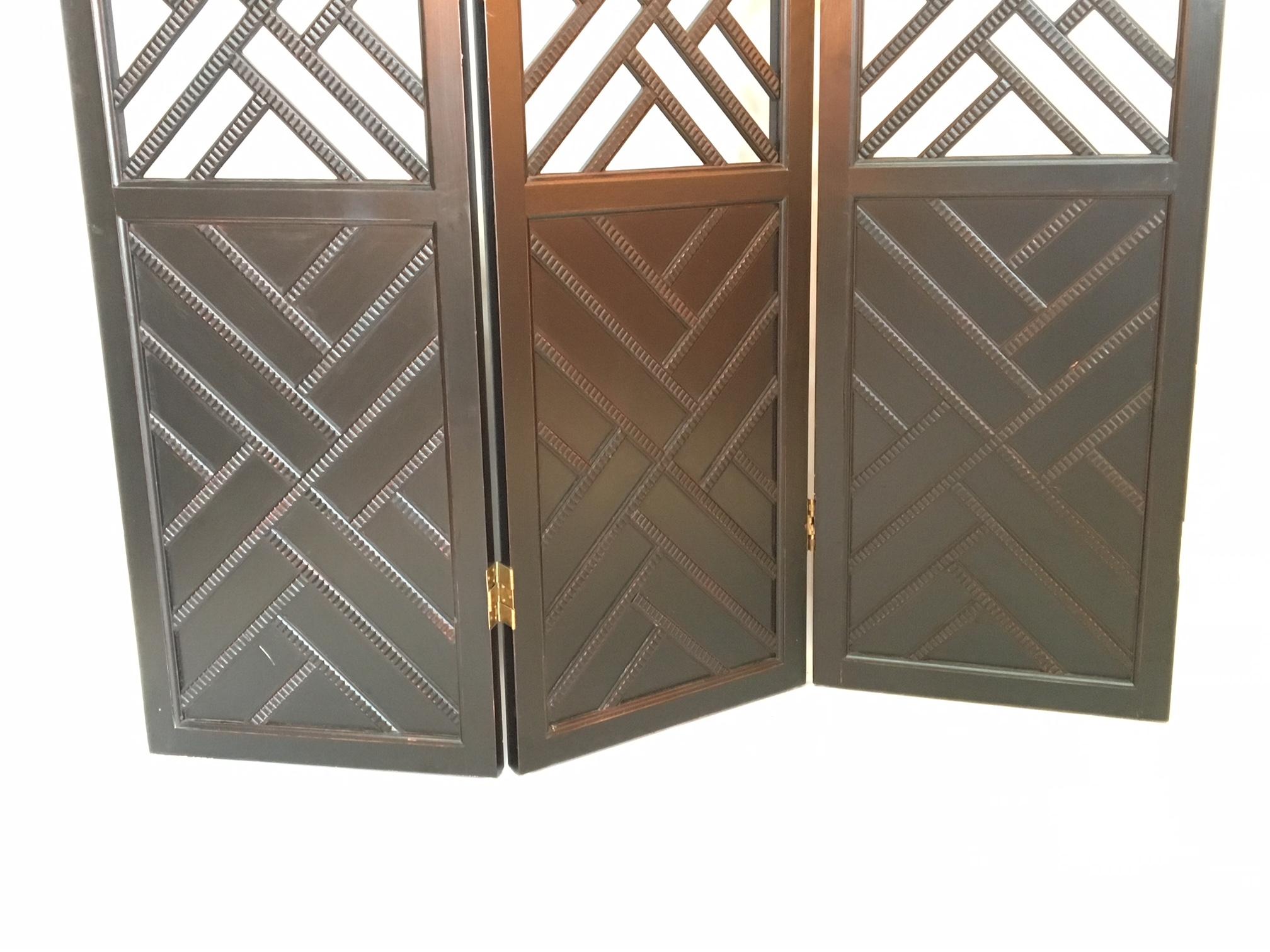 Three panel standing screen in Asian Chippendale style. Perfect for your chinoiserie or Hollywood Regency decor. Good condition with minor abrasions. Stands just over 76