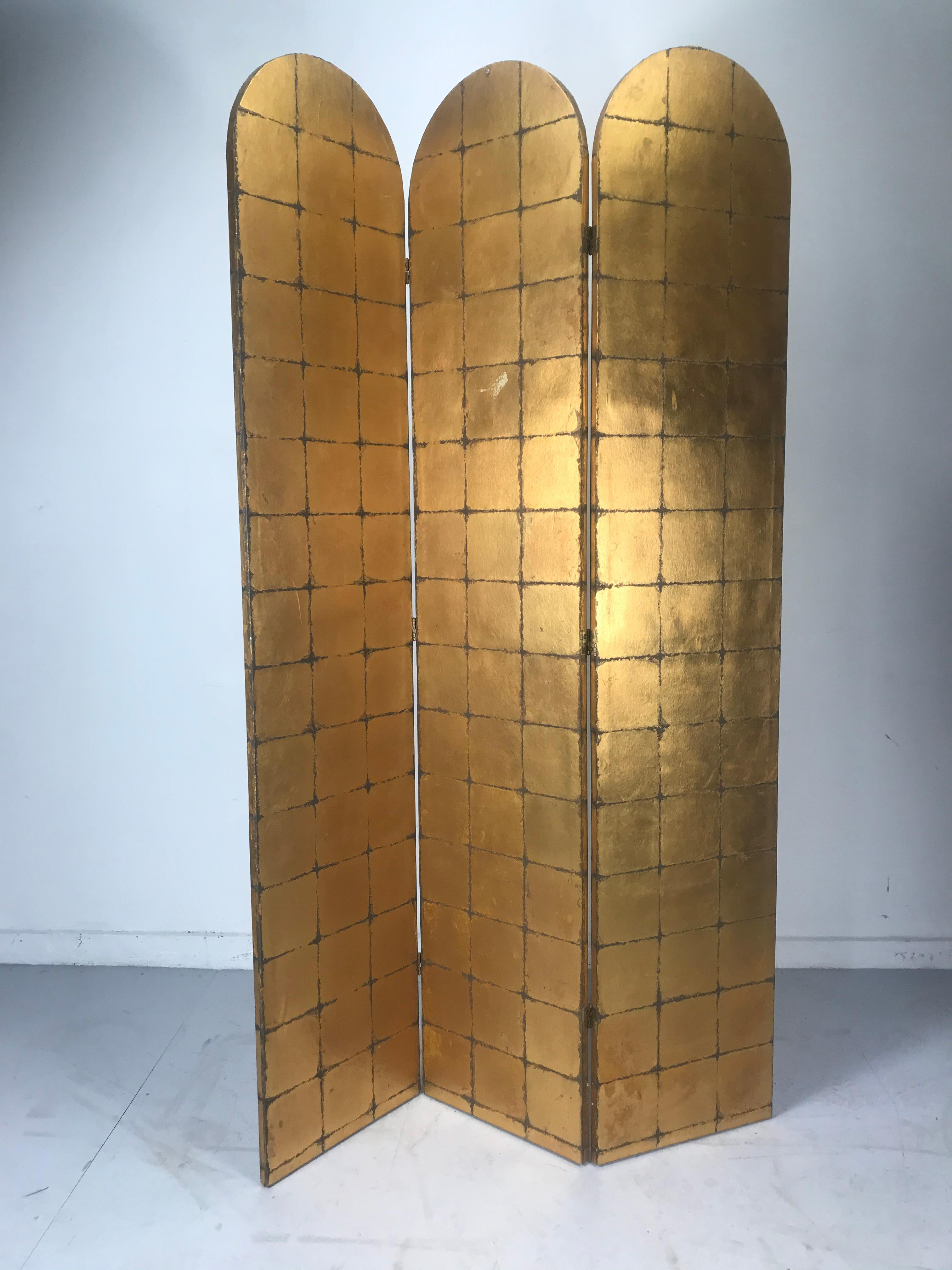 Stunning three arch panel gold leaf screen, room divider, made in Italy. Beautifully decorated gold leaf. Flower plant, lattice motif. Minor paint loss to backside. See photo, Beautiful addition to any room setting, environment. Each panel measures