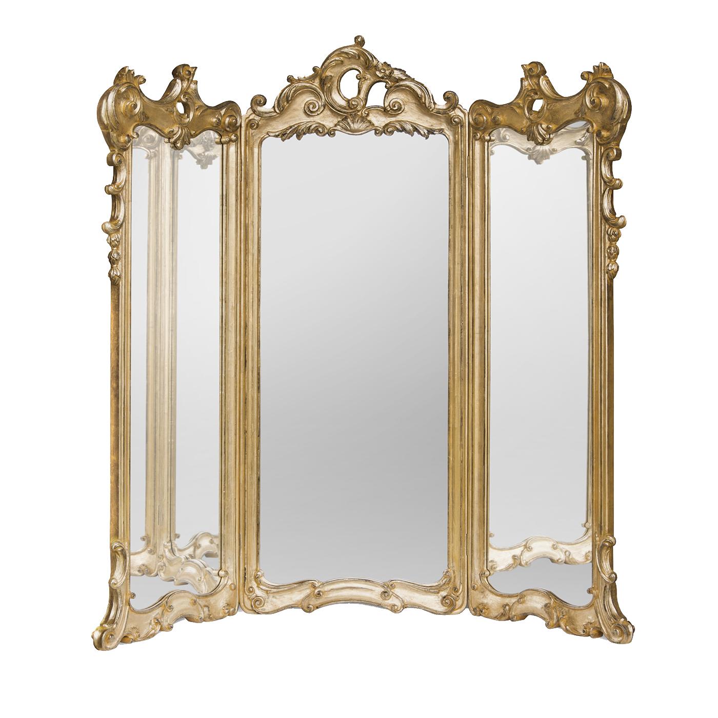 Majestic in its size and scope, this sophisticated mirror in three parts boasts a hand carved wooden frame that was coated with precious gold leaf and finished with an elegant aged patina. This stunning piece can also double as screen, since the two