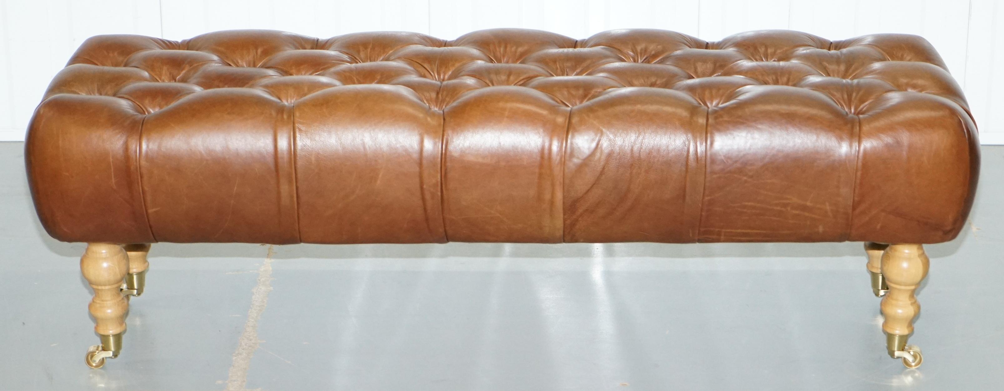 We are delighted to offer for sale this very nice oversized three-person Chesterfield Chestnut brown leather footstool

A good looking and well-made piece, the frame is beech and other hardwoods, the leather upholstery is Scottish fully aniline