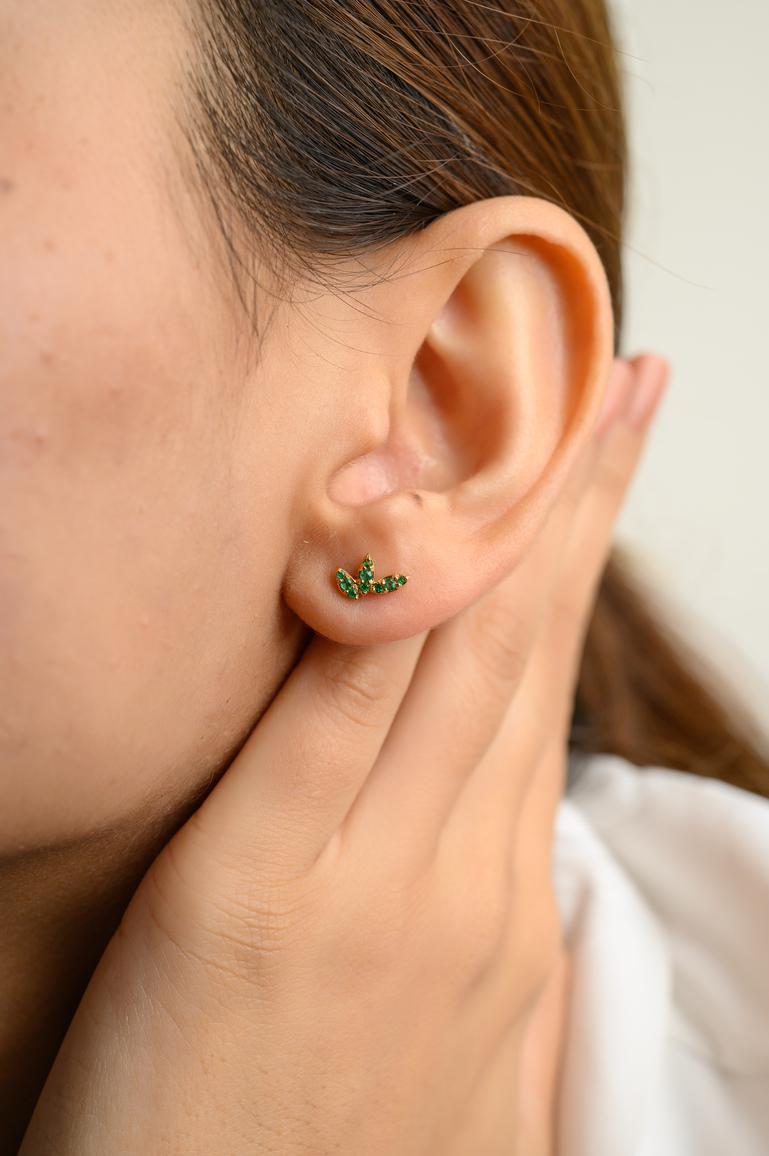 Three Petal Tiny Natural Emerald Stud Earrings in 18K Gold to make a statement with your look. You shall need stud earrings to make a statement with your look. These earrings create a sparkling, luxurious look featuring round cut emerald.
Emerald