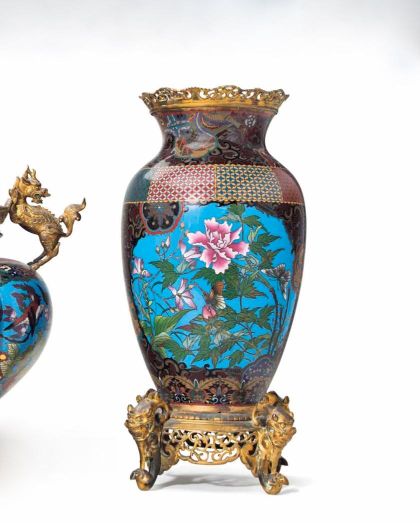 Finest quality three piece chinoiserie style 19th century French bronze mounted Closene enamel Garniture set comprising a pair of vases and a centerpiece.
The bronze mounts are French 19th century and the Closene enamels are Japanese Meiji Period.