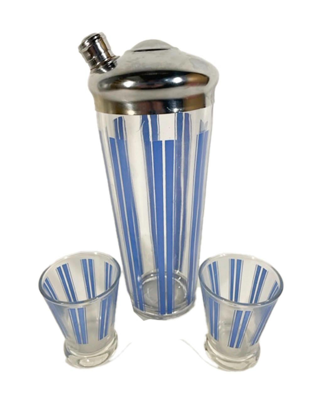 Art Deco cocktail shaker set with pairs of wide blue enamel vertical lines between pairs of narrow lines, the Shaker with a chrome lid with off center side pour spout. The set consists of a Shaker and pair of weighted cocktail/martini glasses.