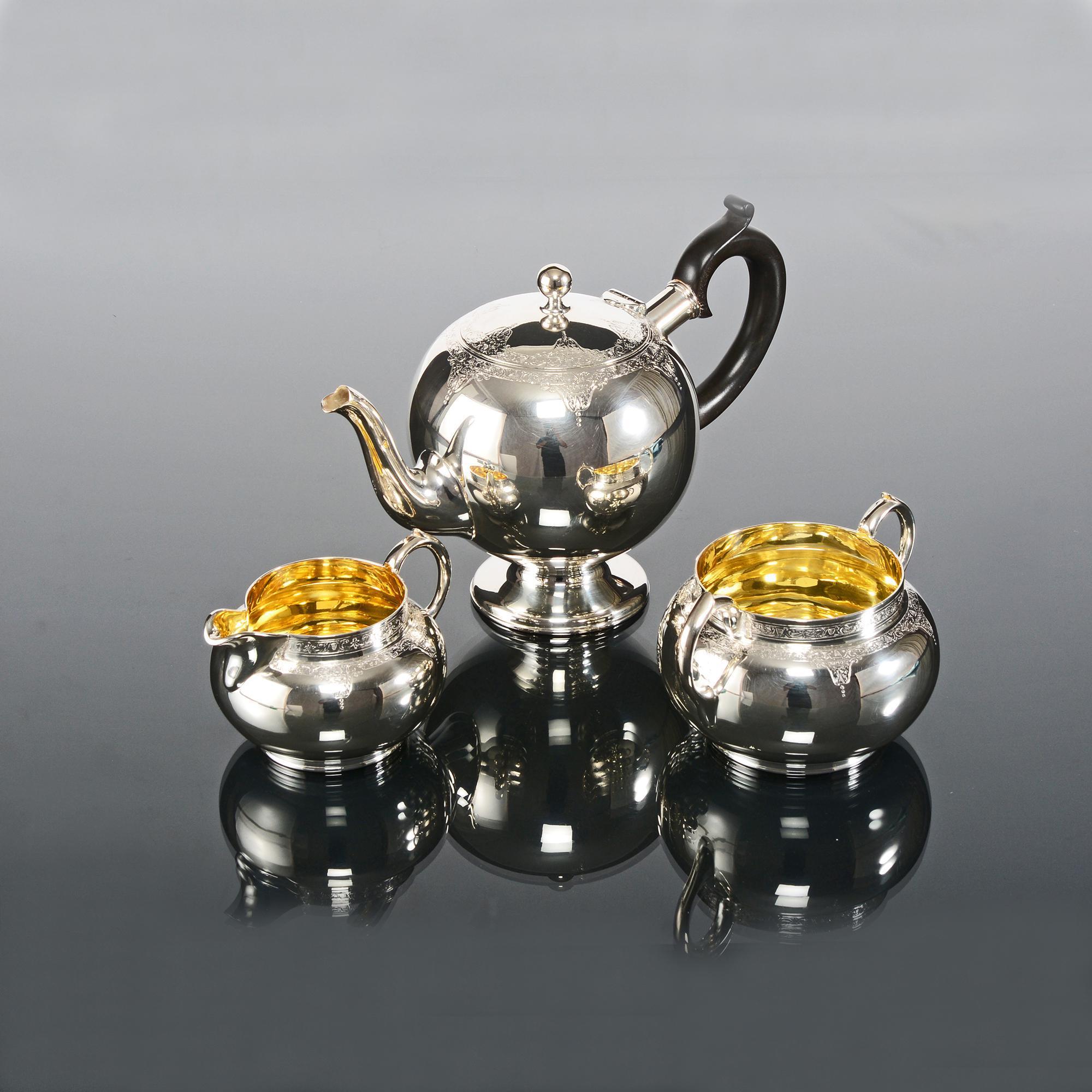 Pleasing three-piece late-Victorian silver tea set with hand raised and delicately hand engraved bodies. The silver teapot has an elegant spout that pours perfectly and is fitted with a fruitwood handle featuring a typical thumbpiece, while the lid