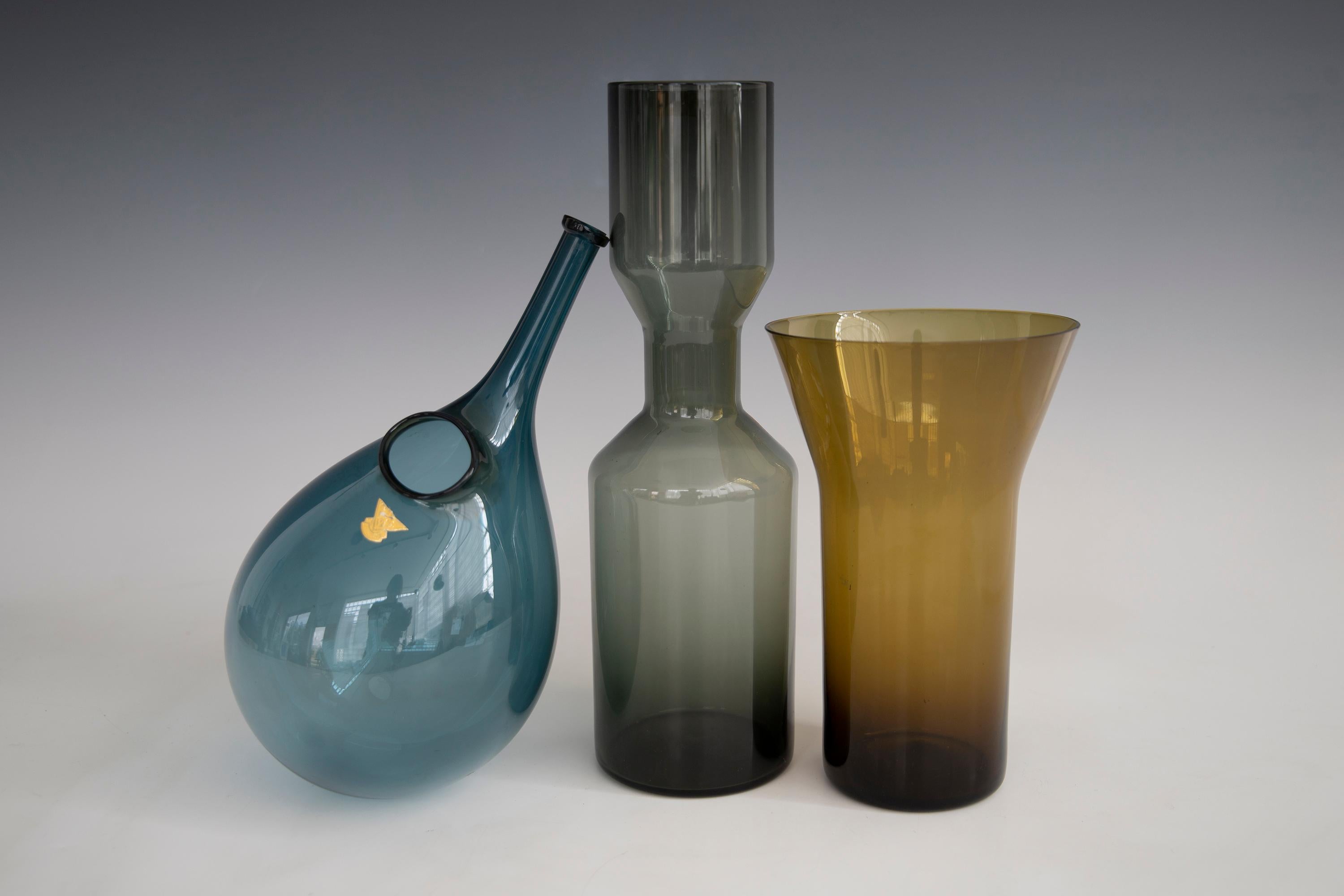 Three pieces of finely formed colored glass. Two are Swedish the pinched cylinder piece is Finnish. Tallest is 11