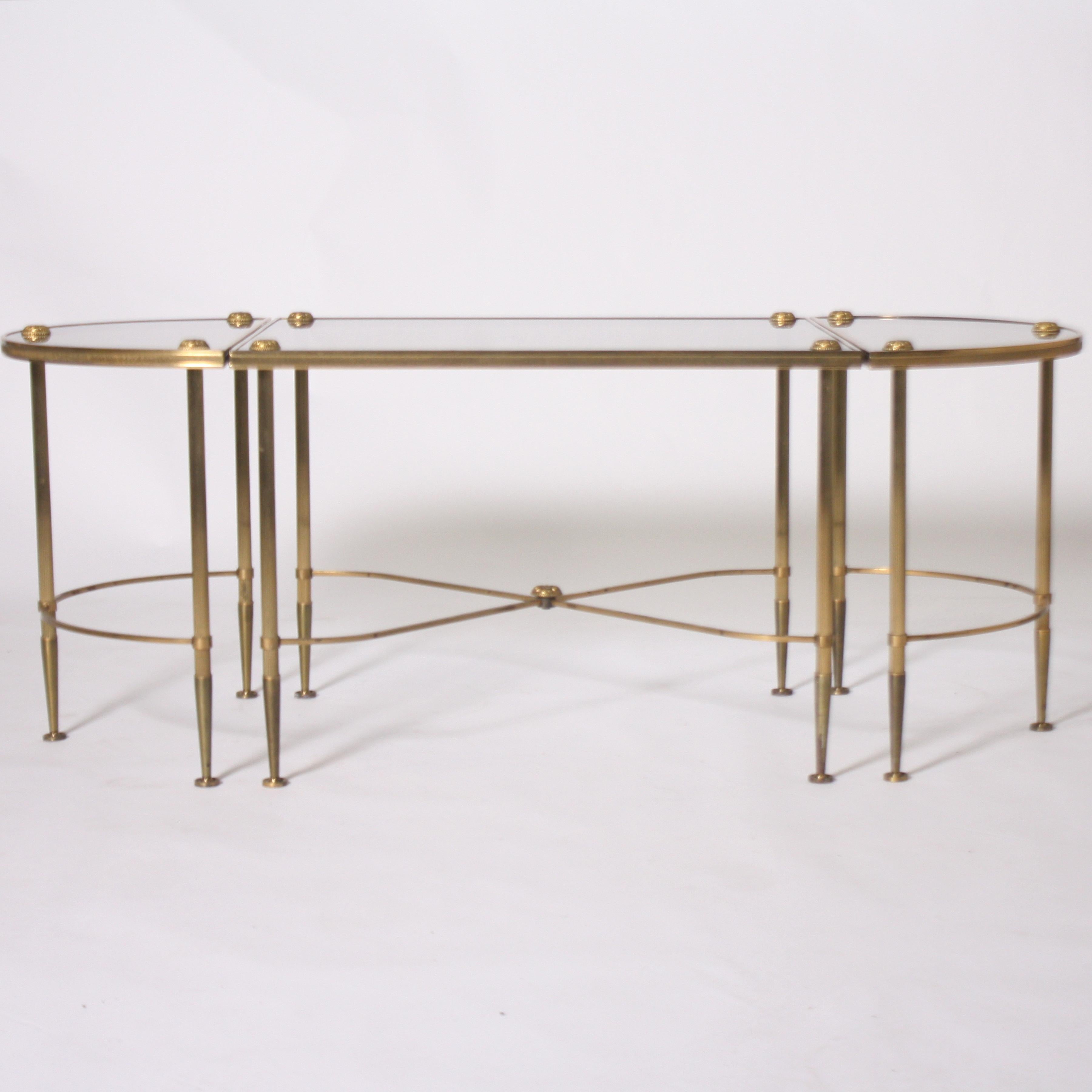 Three-piece brass and glass Bagues coffee table, circa 1950.