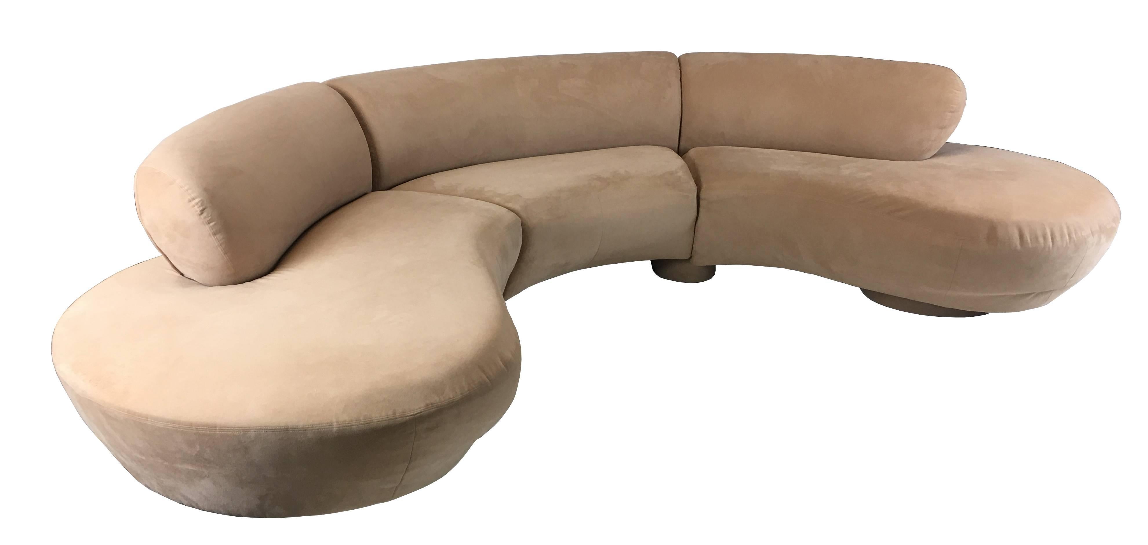 Sculptural three-piece free-form Cloud sofa by Vladimir Kagan for Directional. The three sections are connected by oval plinth style bases and the two ends are raised on round plinth bases upholstered in the same fabric. The sofa is upholstered in