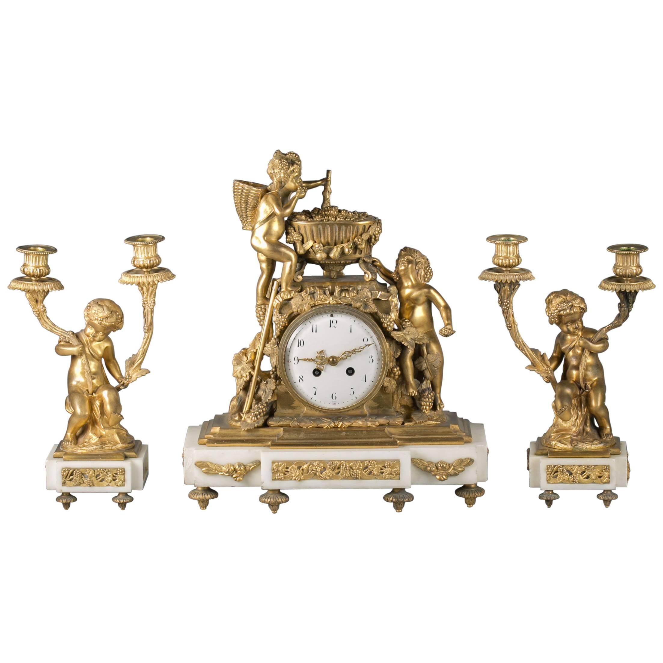Three Piece French Bronze and Marble Clock Garniture, circa 1875