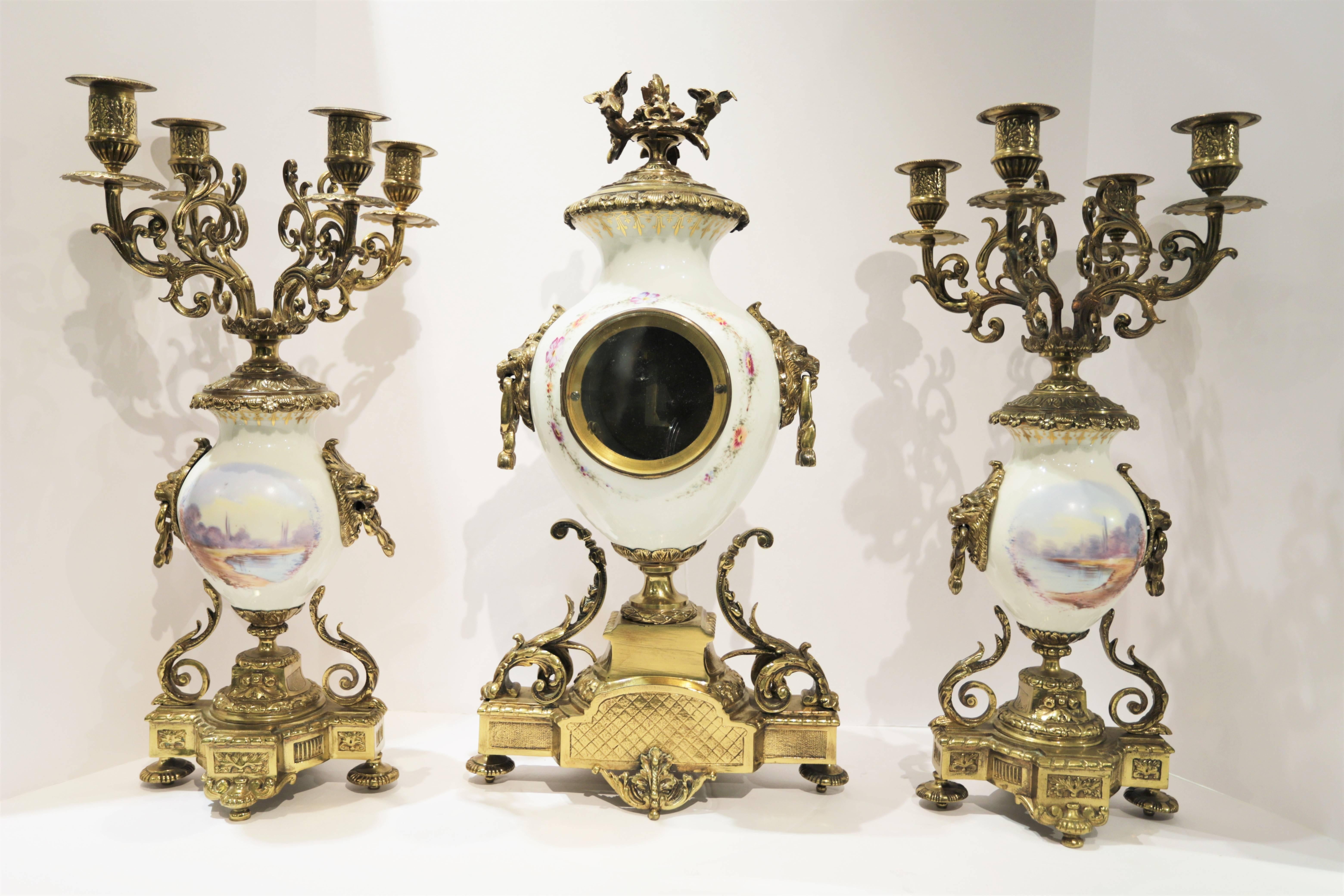 Three-piece French 19 century Louis XVI style Sevres porcelain bronze mounted clock set.