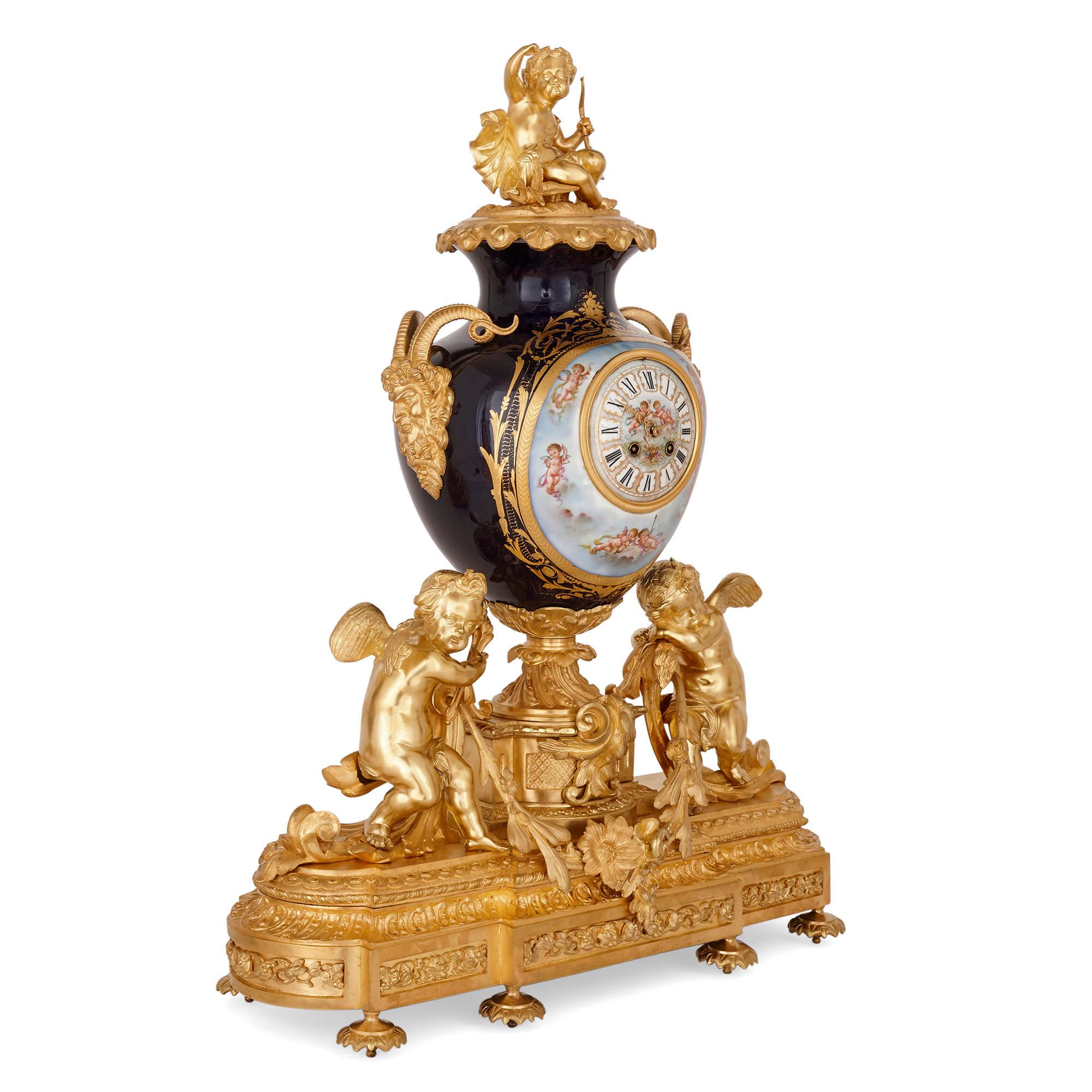 Three-piece Louis XV Rococo style porcelain and ormolu clock set
French, late 19th century
Clock: Height 82cm, width 62, depth 28cm
Candelabra: Height 76cm, diameter 22cm

Comprising of a mantel clock and pair of candelabra, this three-piece