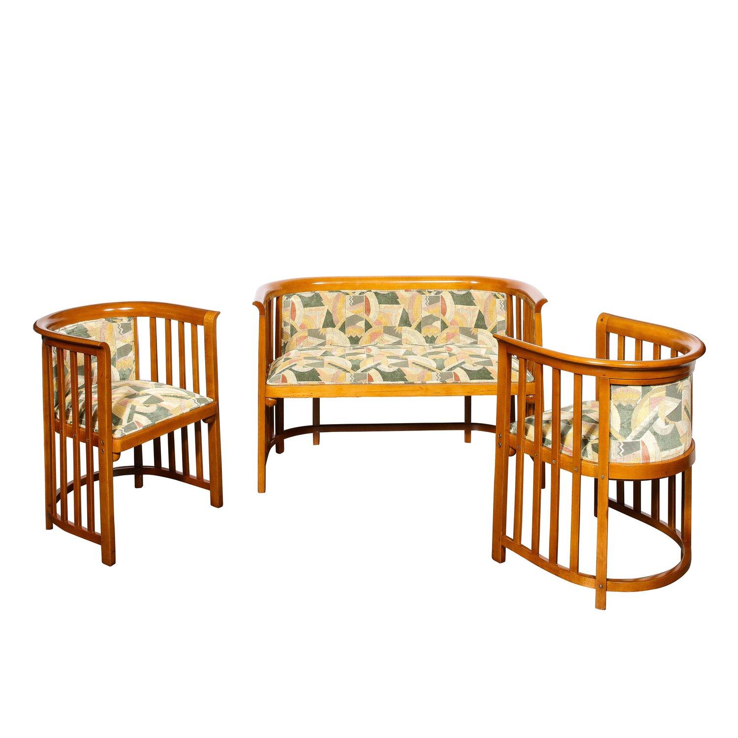 This elegant and refined three piece living room set, consisting of two chairs and a settee were designed by the legendary Josef Hoffman in Austria circa 1905. They feature concave demilune open form silhouettes with evenly spaced vertical supports