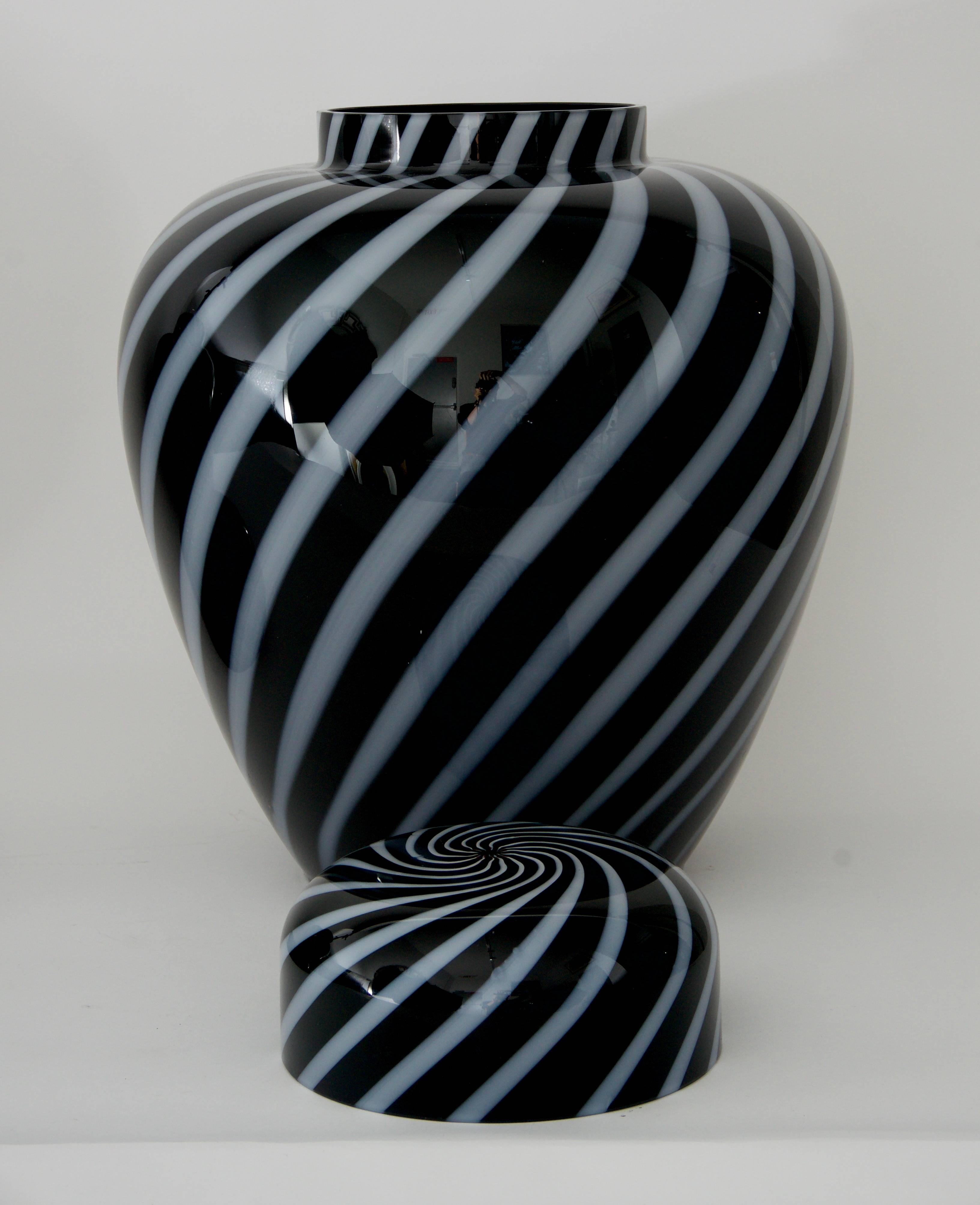 This stylish three-piece set of Vetri Murano glass was recently acquired from a Palm Beach estate and will make a definite statement in your home. The black and violet/white swirl pattern gives the pieces a great sense of movement.

Note: